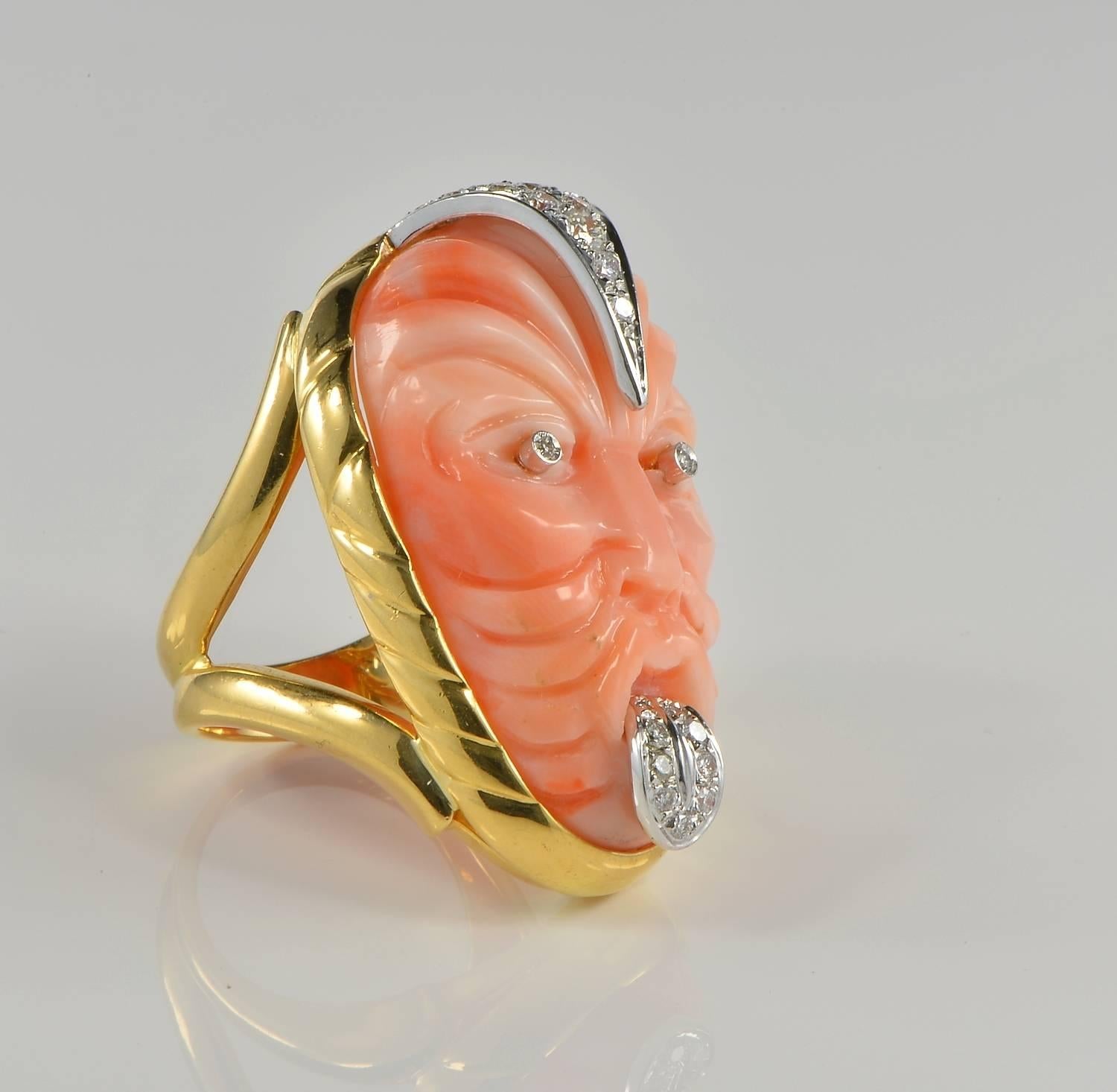 A Rare and unique vintage ring dating 1970 ca, featuring a jumbo size Natural Coral mask featuring a Maori face with a Pukana expression.
Pūkana

Pūkana or facial expressions are an important facet of Māori performance. They help emphasise a point