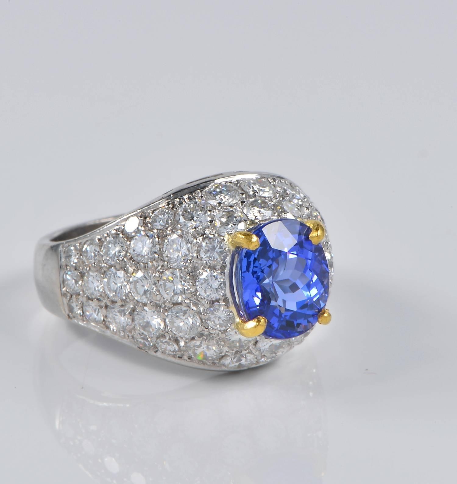 Tres chic vintage ring hand crafted as individual piece during 70' of solid Platinum.
Italian origin.
Set with a centre vibrant Tanzanite of gorgeous Blue Purple colour. 2.40 Ct in weight calculated on mounting.
Fantastic boule designed with