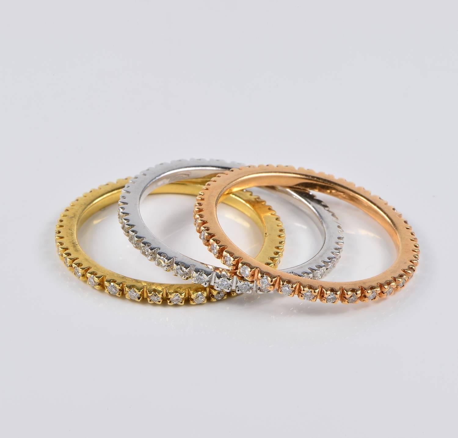 Symbolizing eternity; three full hoops set with Diamonds running through with neverending sparkle.
Hand crafted of solid 18 KT gold - three gold colours: Yellow, White and Rose.
Italian origin. 
Each hoop is set with 32 tiny Diamonds - the three
