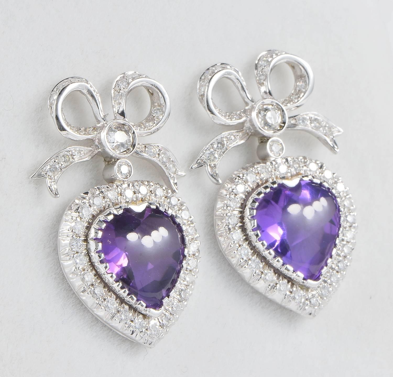 Exclusive and terrific pair of heart shaped Amethysts and bow top. A vintage pair dating 1960 ca. Italian origin.
Fantastic, timeless design of infinite elegance. Prizing exquisite workmanship.
Made of solid 18 KT white gold, marked.
Then focal