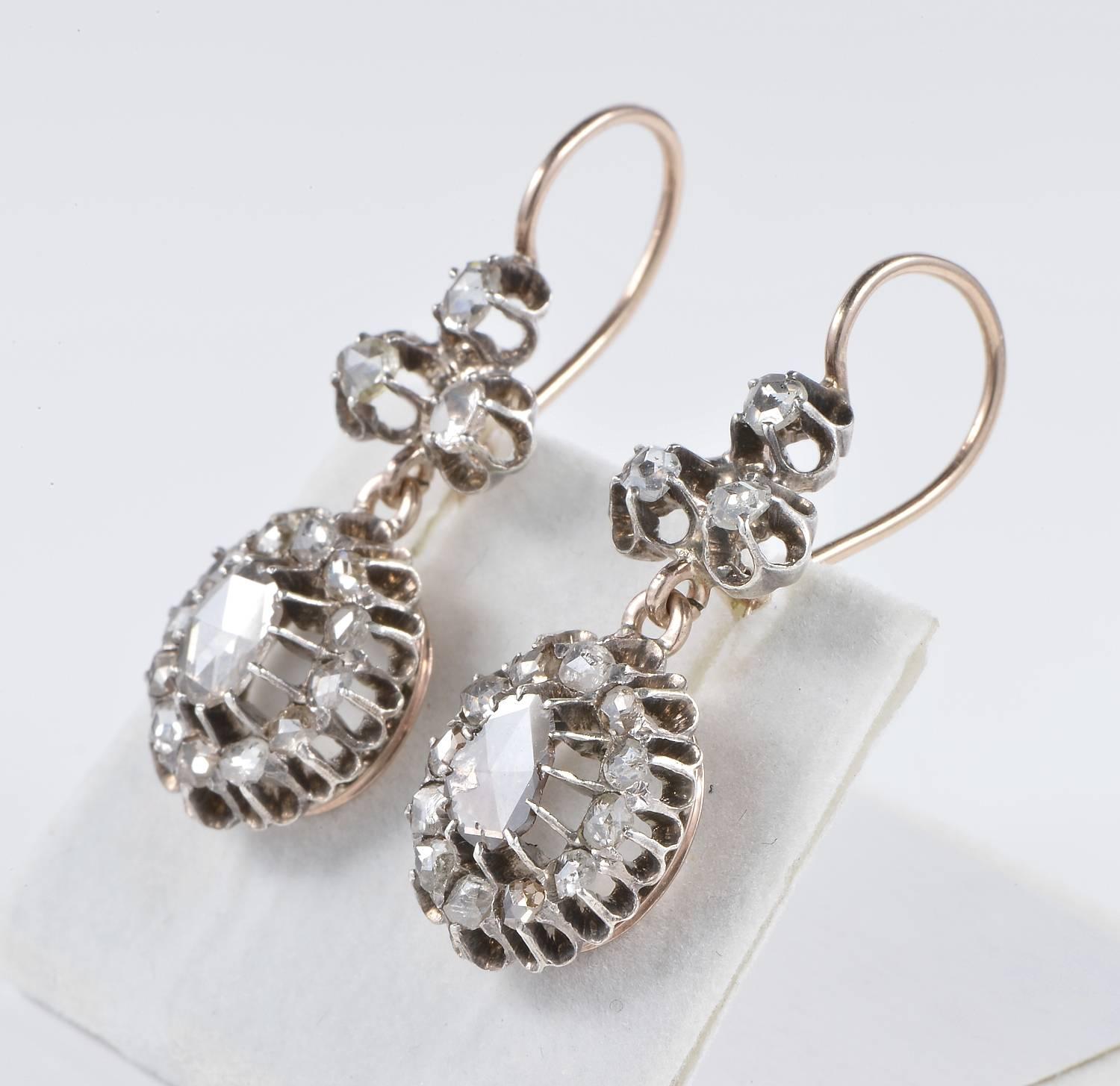 A terrific pair of authentic Georgian/early Victorian Diamond drop earrings.
Fabulous in design, glorious workmanship from the time.
Hand crafted of solid 18 kt rose gold and silver as for age.
Fully set with opulence of rose cut Diamonds of fine