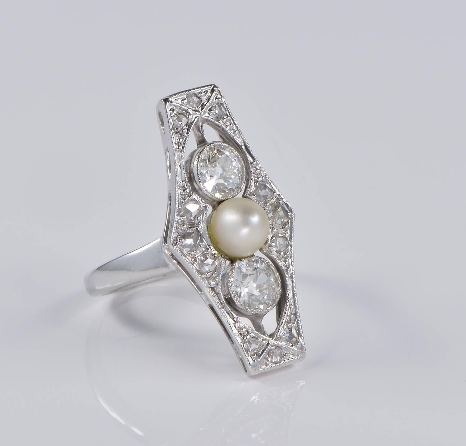 Elegantly designed and superbly hand crafted of solid Platinum, authentic Belle Epoque panel ring.
Tested for Platinum, 1900 ca.
The elongated panel is set with a centre Natural - not nucleated sea pearl- and .80 Ct of old cut Diamonds rated as G/H
