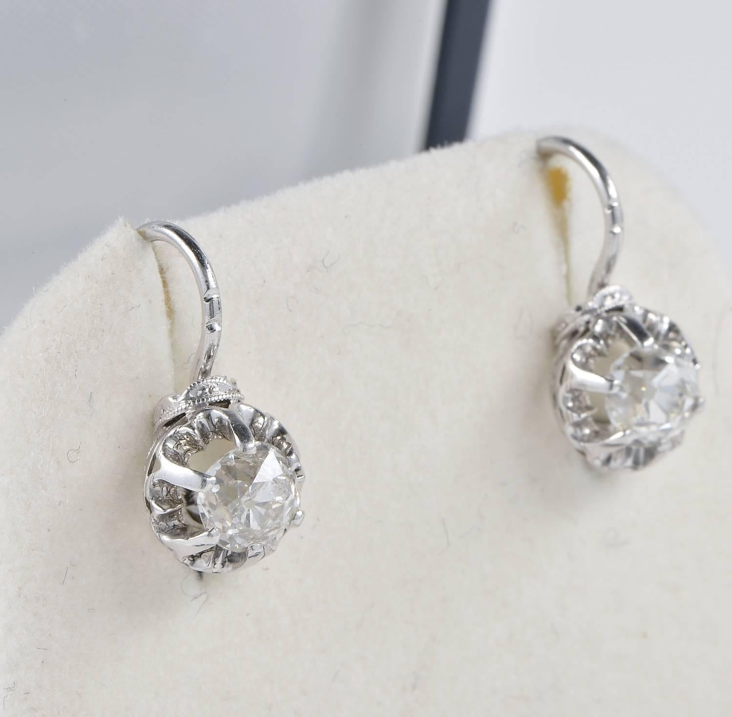 Authentic Art Deco Diamond solitaire earrings, boasting two old mine cut Diamonds G/H colour VVS for one I grade for the other Diamond. Rare, antique Diamonds of good size make a must have for this pair of earrings. Feminine and enchanting the way