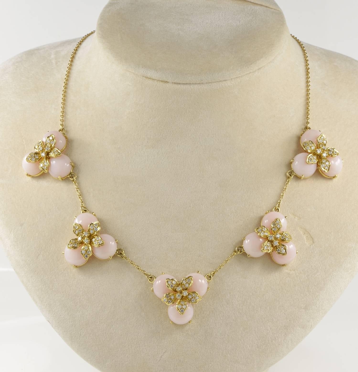 A one off necklace exclusively hand crafted of solid 18 KT gold - marked
Italian origin, 1960/70 ca.
Terrific tasteful design of flowers made of natural Pink Opals remarked by Diamonds and gold corolla 
So divine! Easy wear and very matchable with