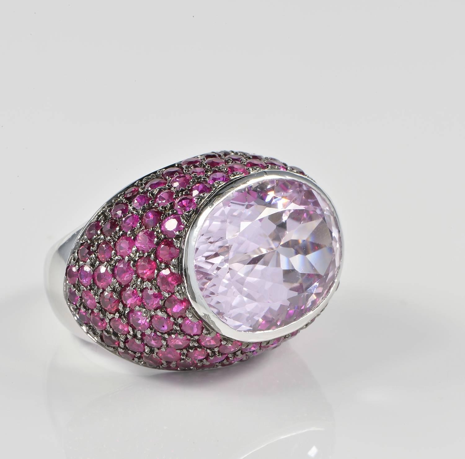 Outstanding Italian contemporary design hand crafted of solid 18 Kt white as individual piece of jewellery.
Set throughout with over 5.0 Ct of natural Rubies on blacked platinum.
The main gemstone is a striking large 18.0 Ct Natural Kunzite of