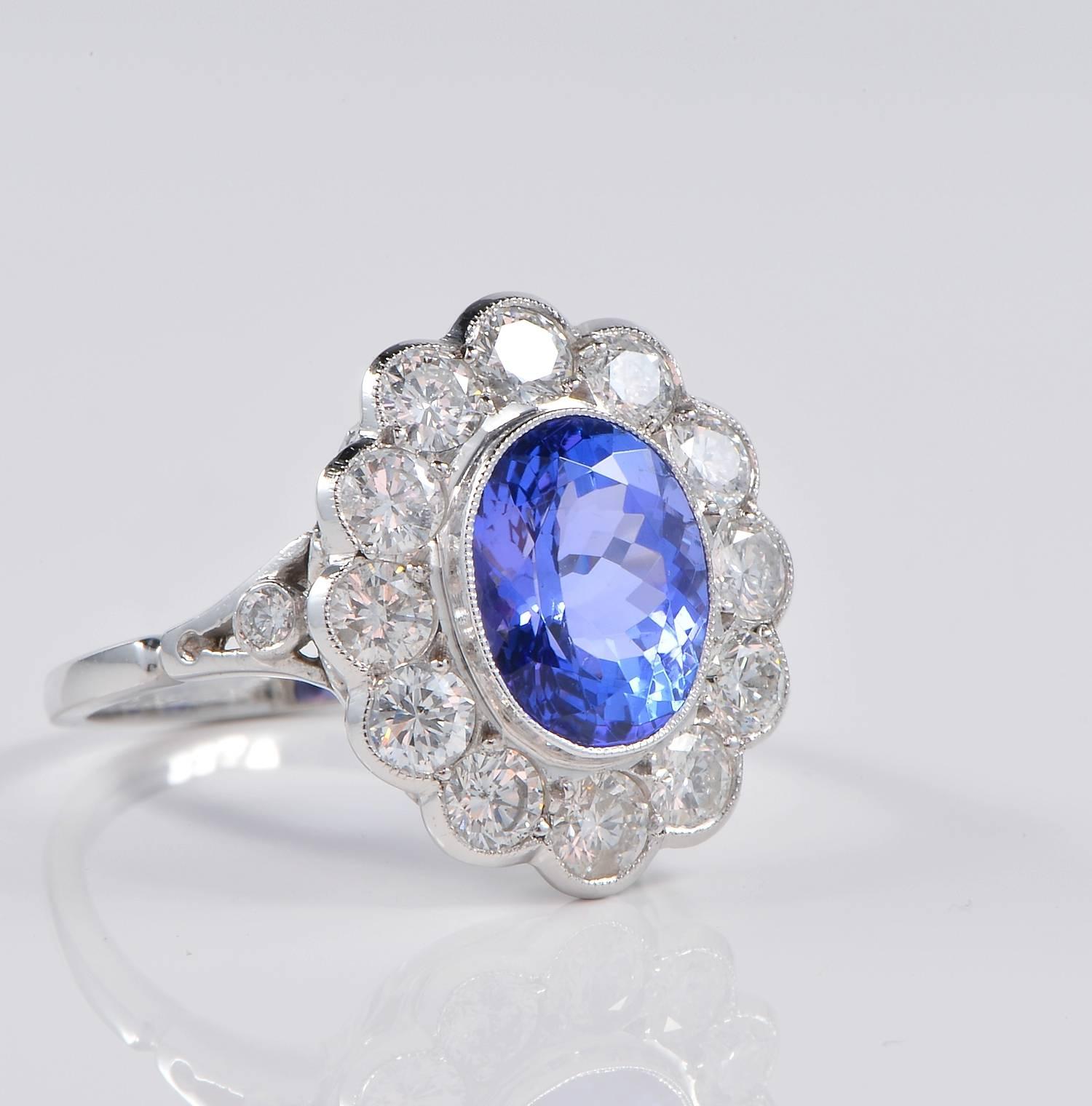 
Superb classy style ring hand crafted mounting of 18 Kt.
Centrally set with a beautiful natural Tanzanite of 3.60 Ct, spectacular blue purple colour.
Surrounding Diamonds content is 2.60 Ct of G VVS/VS round brilliant cut Diamonds of finest