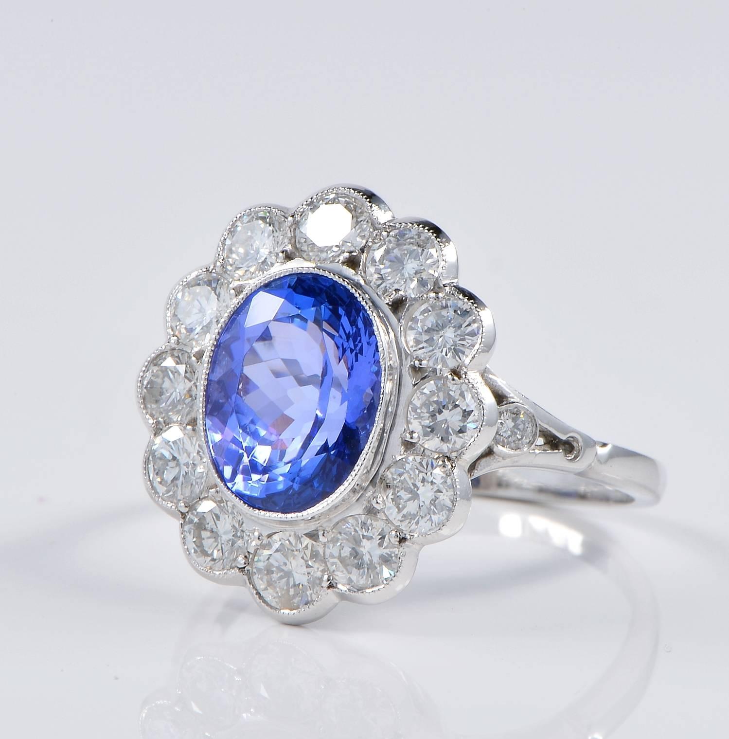 Art Deco 3.60 Carat Tanzanite 2.60 Carat Diamonds Halo Ring For Sale