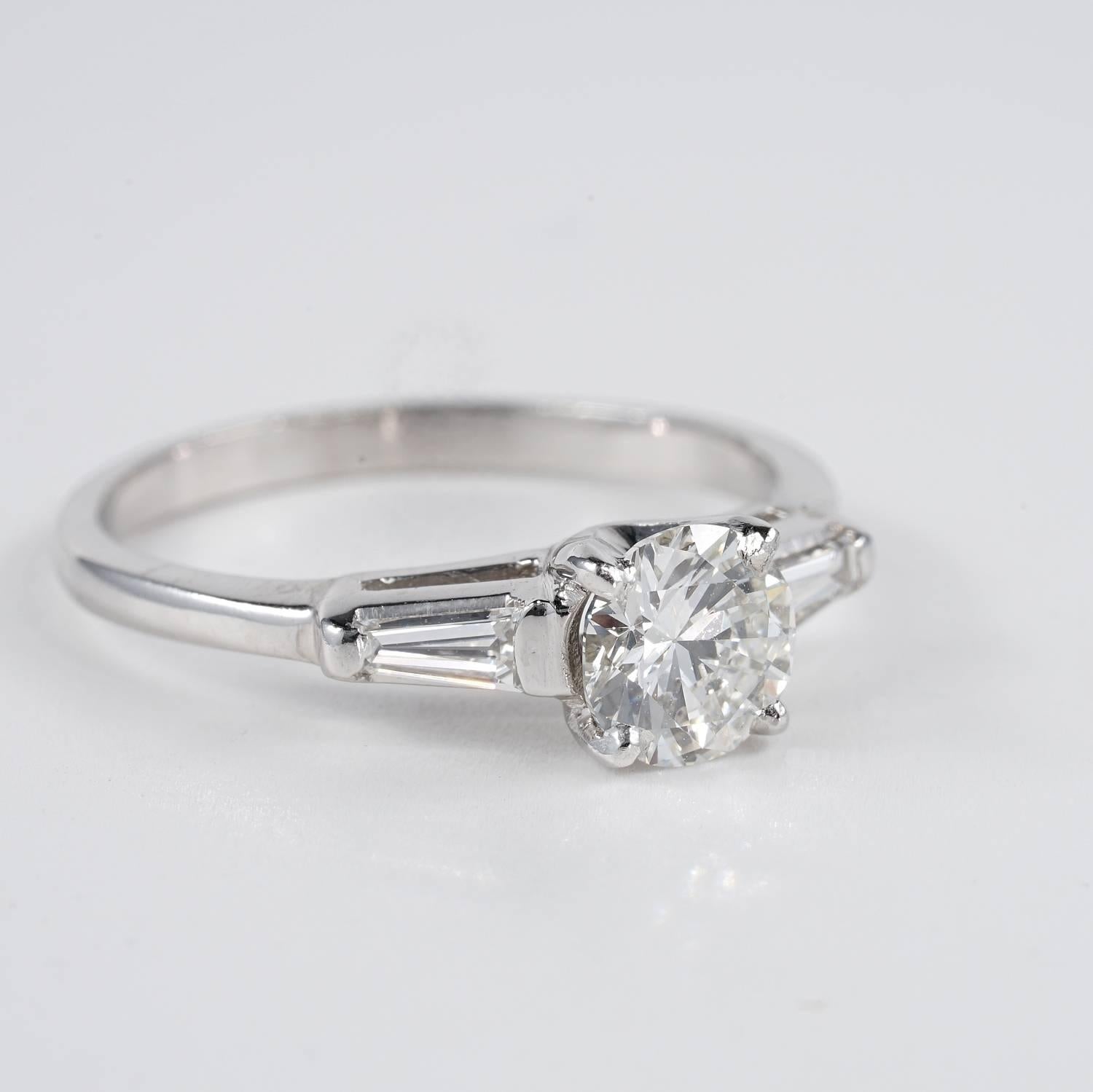 A superb Art Deco Diamond engagement ring all platinum made
Centrally set with a glittering old European cut Diamond of .75 Ct rated G VS
with sides tapered baguettes of .30 CT (G VVS/VS) completing the timeless designed
Skilfully hand crafted of