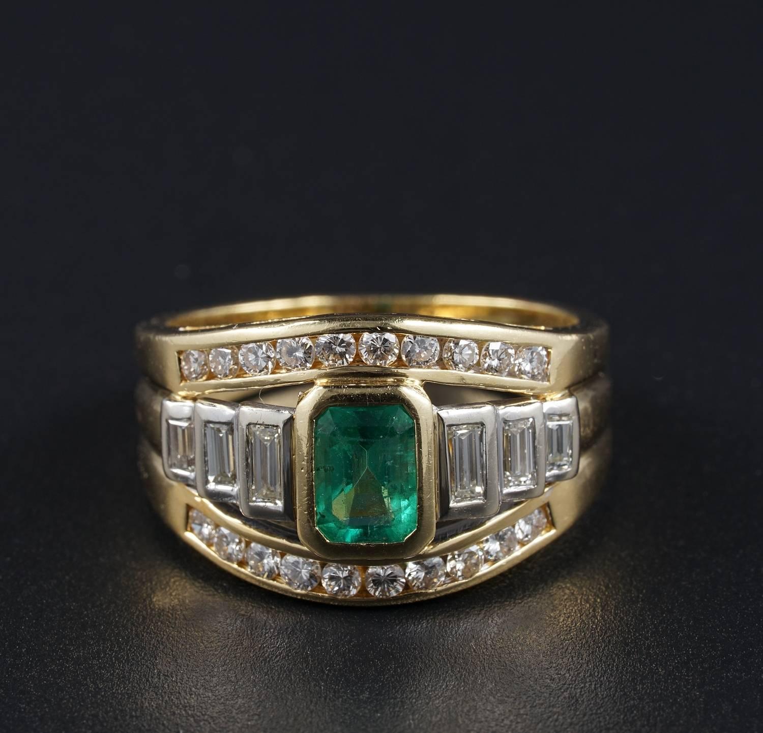 Greatly designed as wide band in a classy style very wearable and elegant ring
Totally hand made mounting of heavy 18 KT solid gold - marked
Centrally set with 1.0 CT Natural Colombian Emerald of fine quality being excellent in colour grade and also
