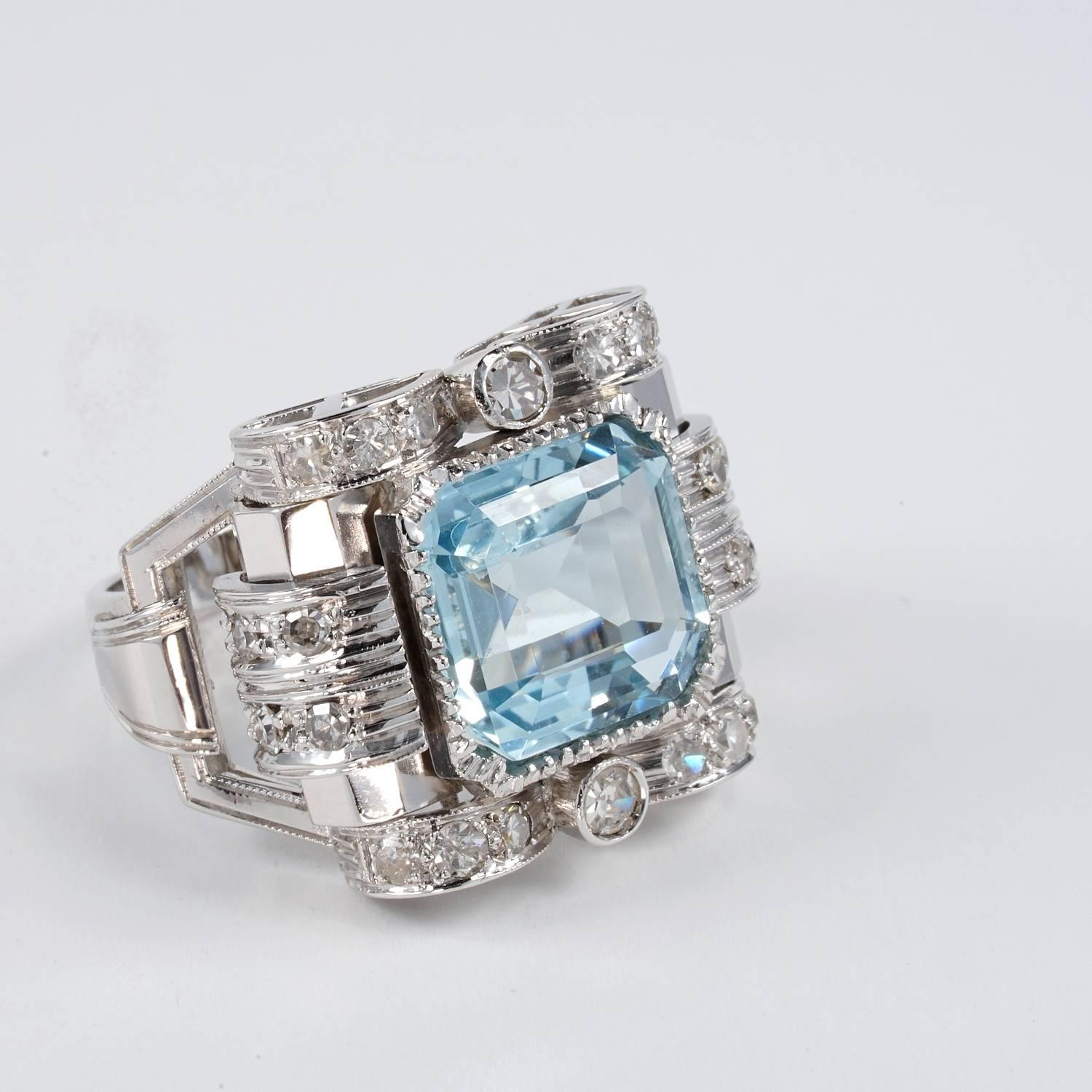 Strong character, beautiful designed, auntentic Art Deco ring hand crafted of solid 18 KT white gold.
Centrally set with a natural Aquamarine emerald cut of 5.20 Ct.
Complementary old Swiss cut Diamonds for 1.20 Ct
Fantastic condition all