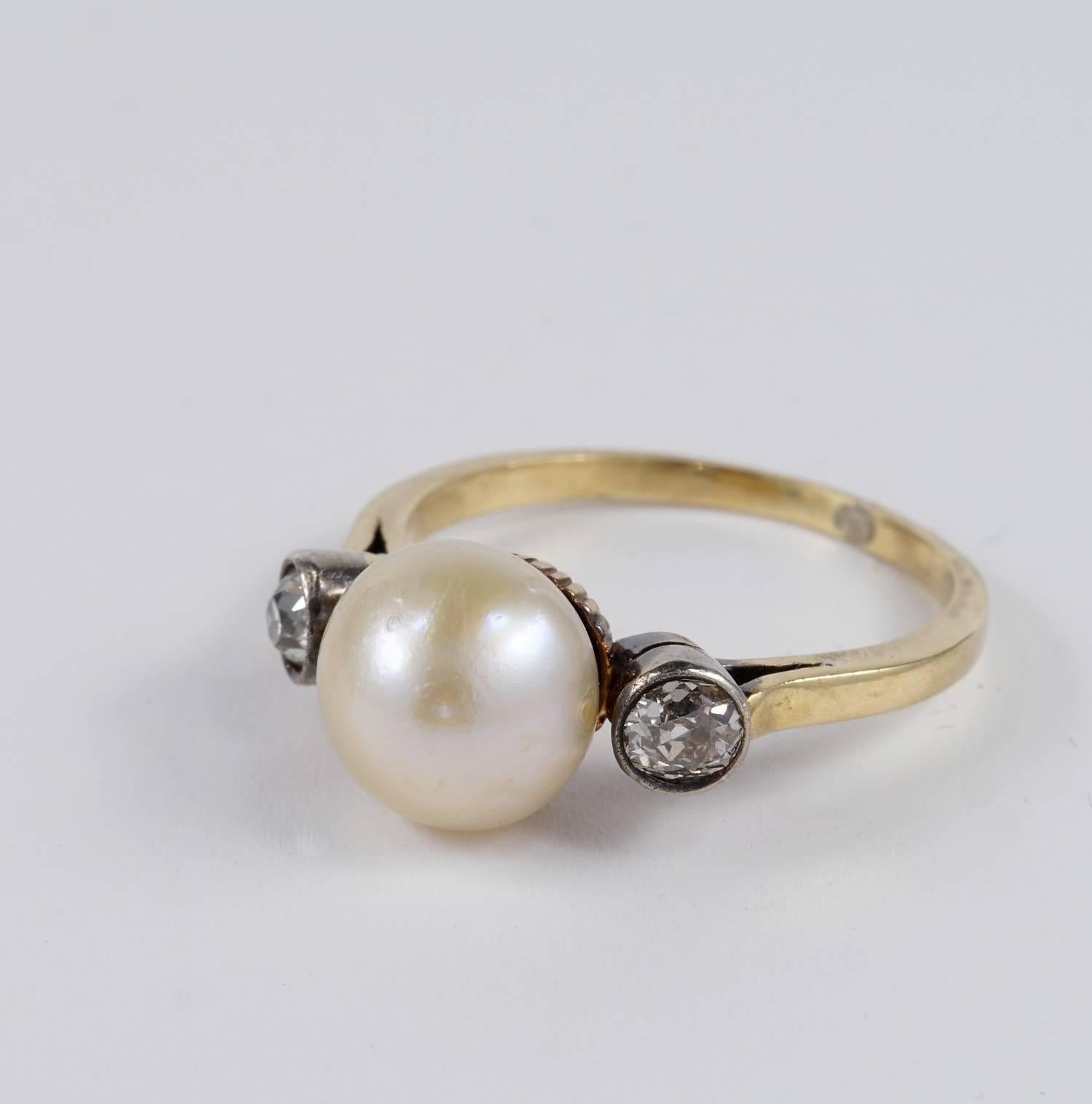 Victorian period in fantastic trilogy version made with a centre Natural Basra Pearl mounted as main solitaire gemstone flanked by two old cut Diamonds
The ring dates back to 1890 ca 
The centre not nucleated pearl is Natural salt sea of great size