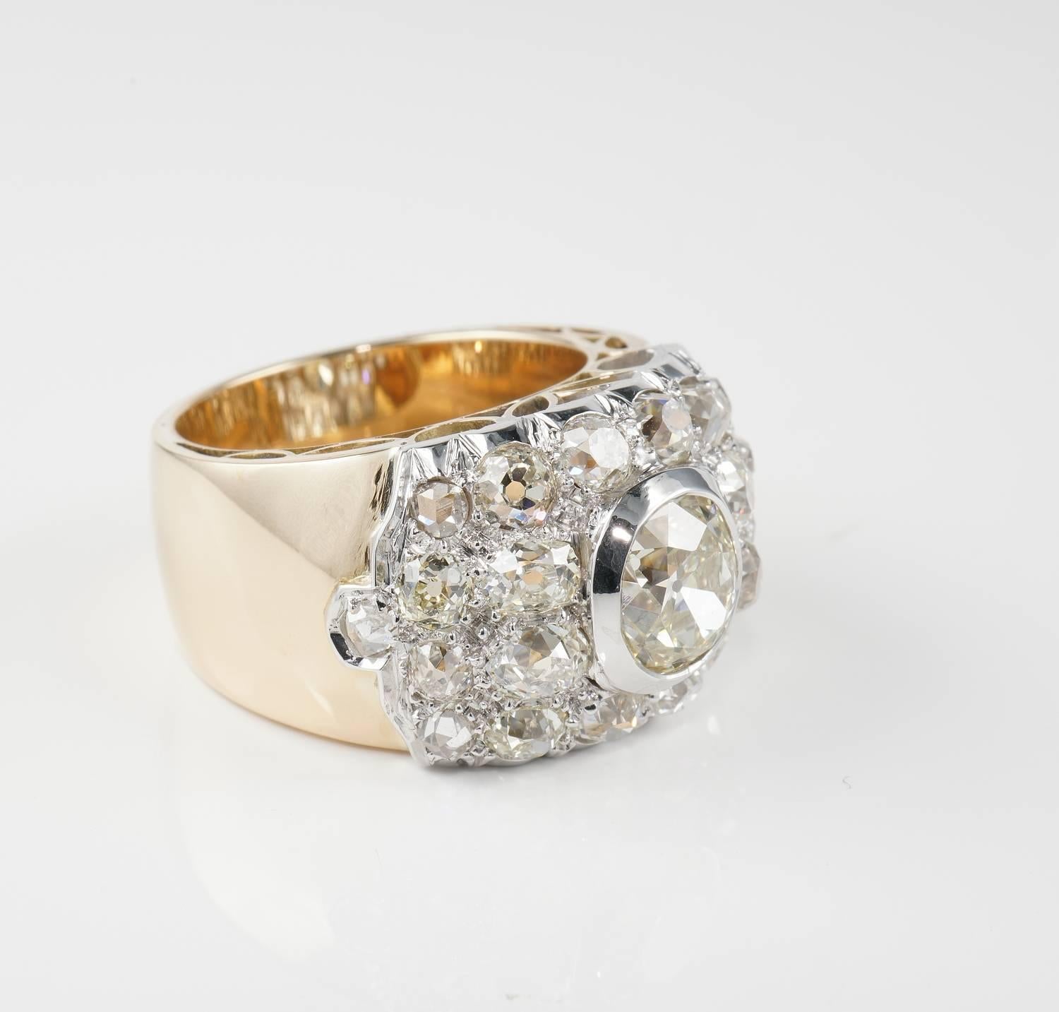 Magnificent authentic Art Deco example richly set with Diamonds, exquisitely crafted of solid Platinum and 18KT rose gold -not marked
Striking net design slightly bombe centring a large oval Cushion old mine cut Diamond of 2.06 Ct rated J/K VVS