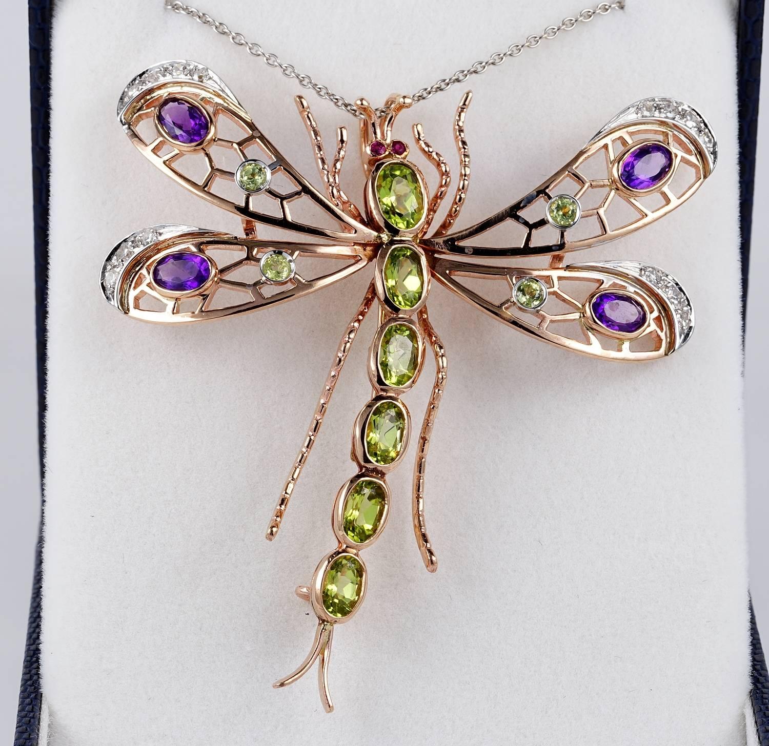 An impressive large sized Dragonfly brooch beautifully hand crafted of solid 9 kT solid gold - marked
Outstanding pierced work skilfully executed enhanced by Natural Amethysts and Peridots with Diamonds portions
All the Sufraggette colours
This is a