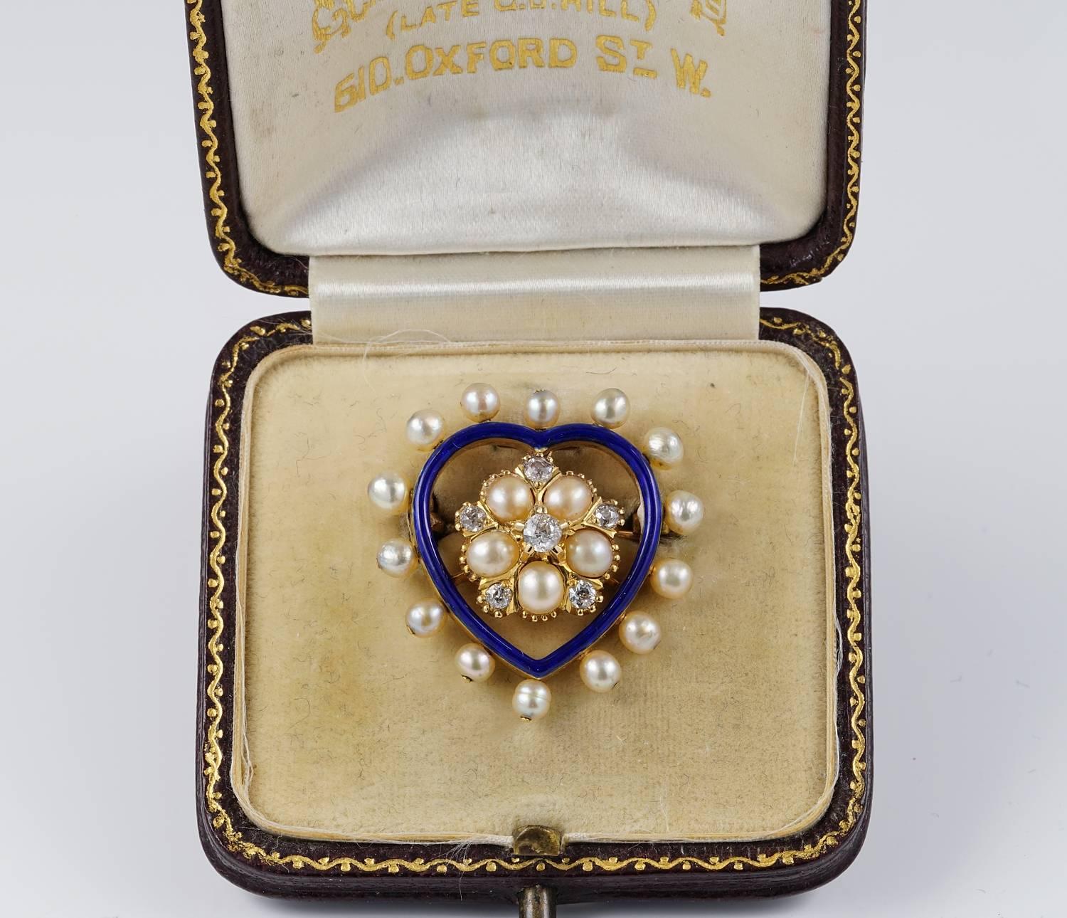 Victorian romanticism
The prettiest Victorian period heart brooch pendant crafted of solid 18 KT gold
A centre Diamond and natural pearl daisy under lined by Royal Blue enamelling in the shape of a heart fully framed by lovely baby 
Natural sea