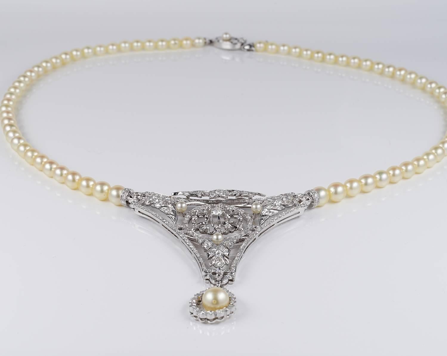 A magnificent rare Example of Cultured Pearl and impressive Diamond centre

Remarkable 18 KT solid gold workmanship which impress for the rich intricate design leaf inspired and naturalistic motifs
even the back side is refined with stunning