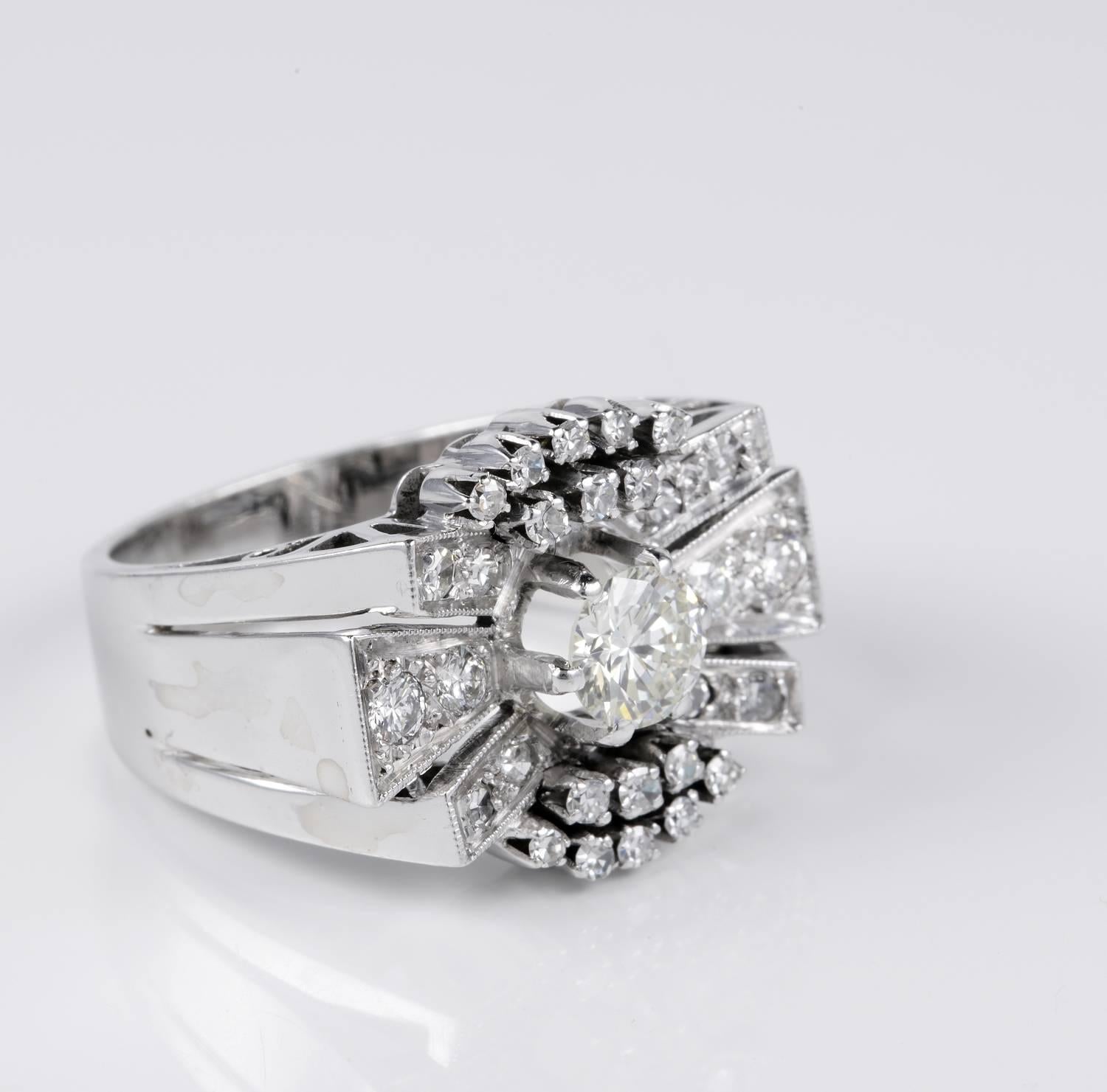 An impressive Art Deco cocktail ring in marvellous bow design expression of glam during the Deco period
Crown boasts a centre old Transitional brilliant cut Diamond of .55 CT rated as G VS –
from this develops the charming Diamond bow with sides