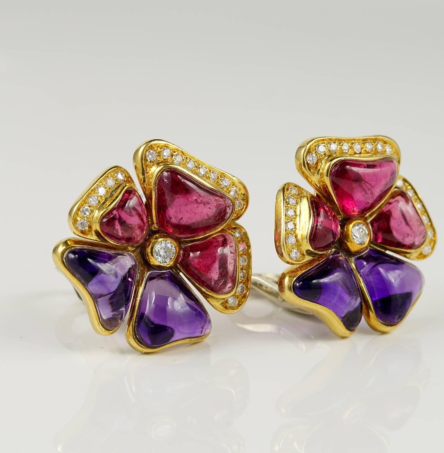 Superb pair of vintage Pansy shaped earrings
Italin origin, signed Loris Abate 
The charming flower is set with skilfully hand carved natural Rubellite and Amethyst petals, rich vivacious in colour,so beautifully polished
Approx content of 18.60 Ct