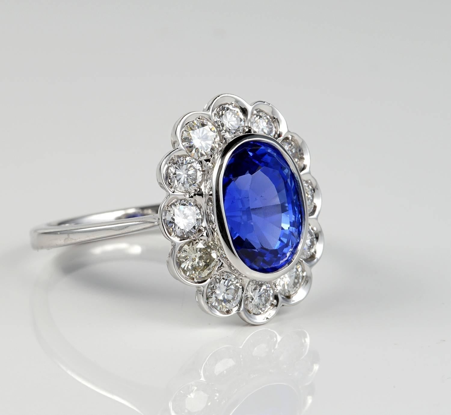 An exceptional natural untreated Ceylon origin sapphire set into a marvellous classic cluster setting
a full dazzling border of best quality diamonds to complement the rich Crown
The sapphire is absolutely stunning either in colour than clarity and