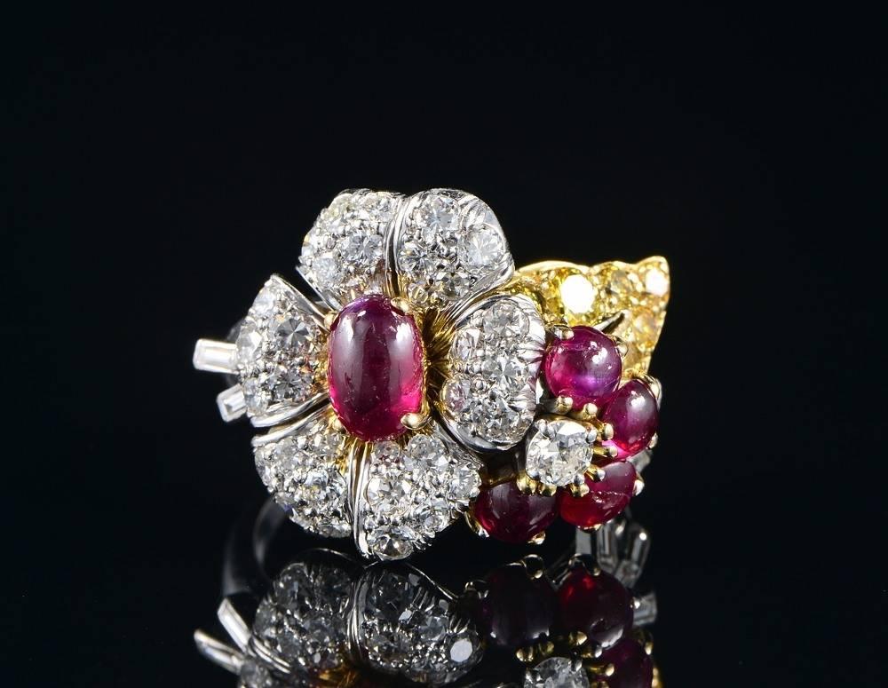Beautifully hand crafted of solid Platinum and 18 Kt gold - not marked.
Designed as a sophisticate flower composition, totally overwhelmed by white Diamonds, deep Red Natural rubies and Fancy yellow Diamonds for a one off combination of colours and