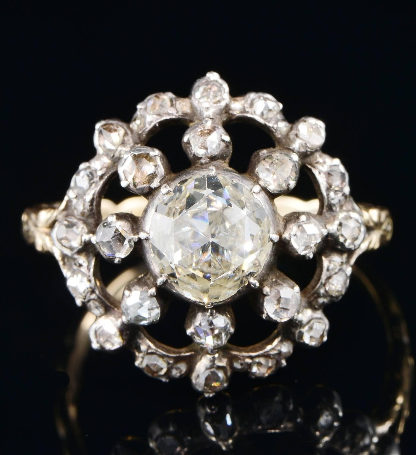 A marvellous example of an original Georgian ring in very good condition and perfectly wearable.
Round shaped of flower inspiration crowned by a large rose cut Diamond set in the middle point this spreads as much as 1.50 Ct measured by the diameter