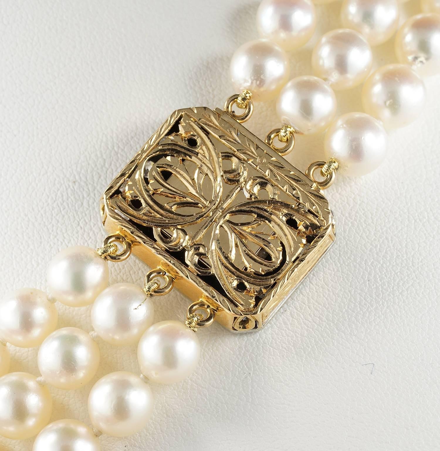 triple strand pearl necklace with diamond clasp