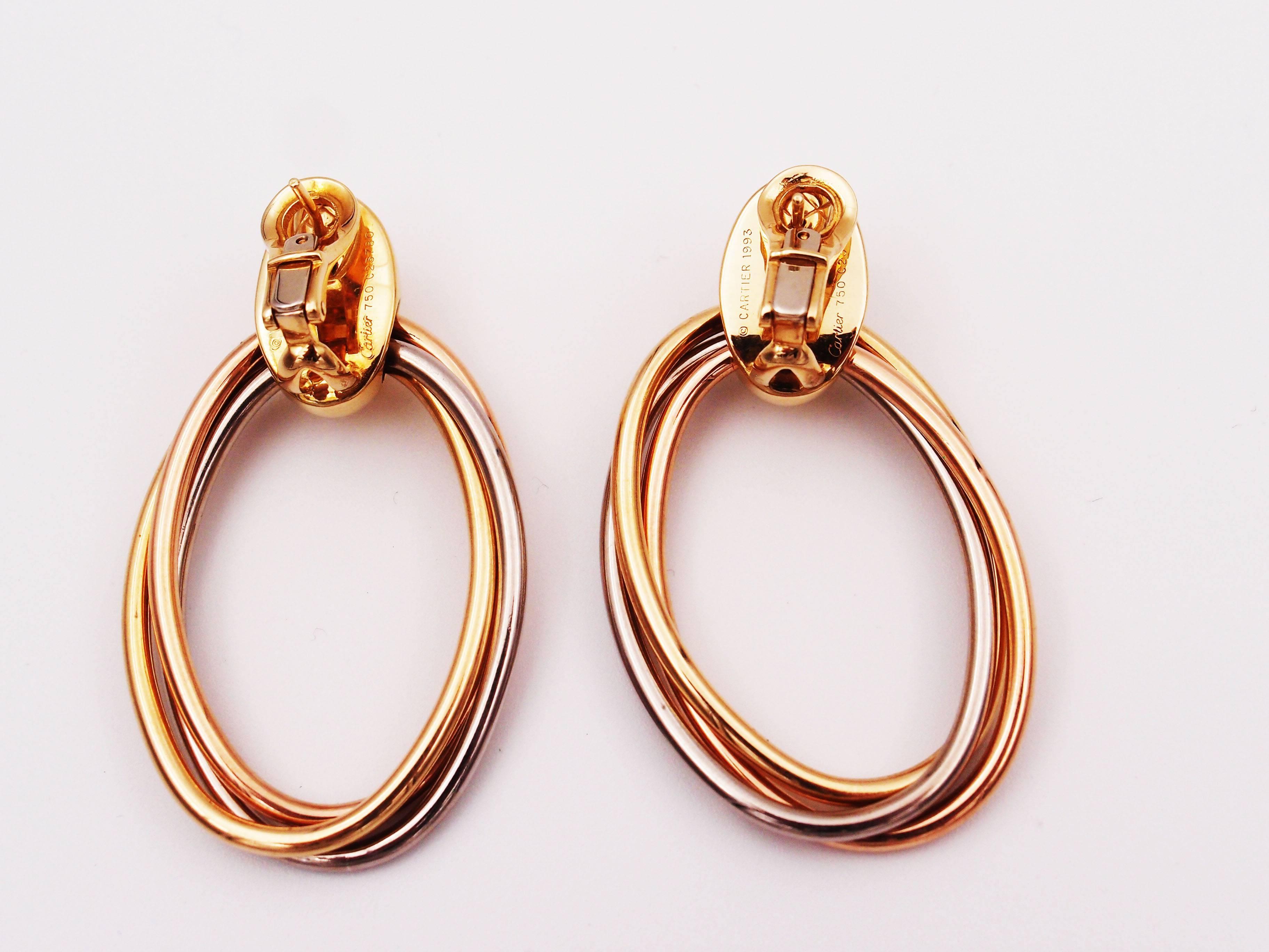 Cartier 18K yellow, white and pink gold trinity oval hoop tri-colored gold earrings
Signed Cartier 1993, serial# C23xxx

