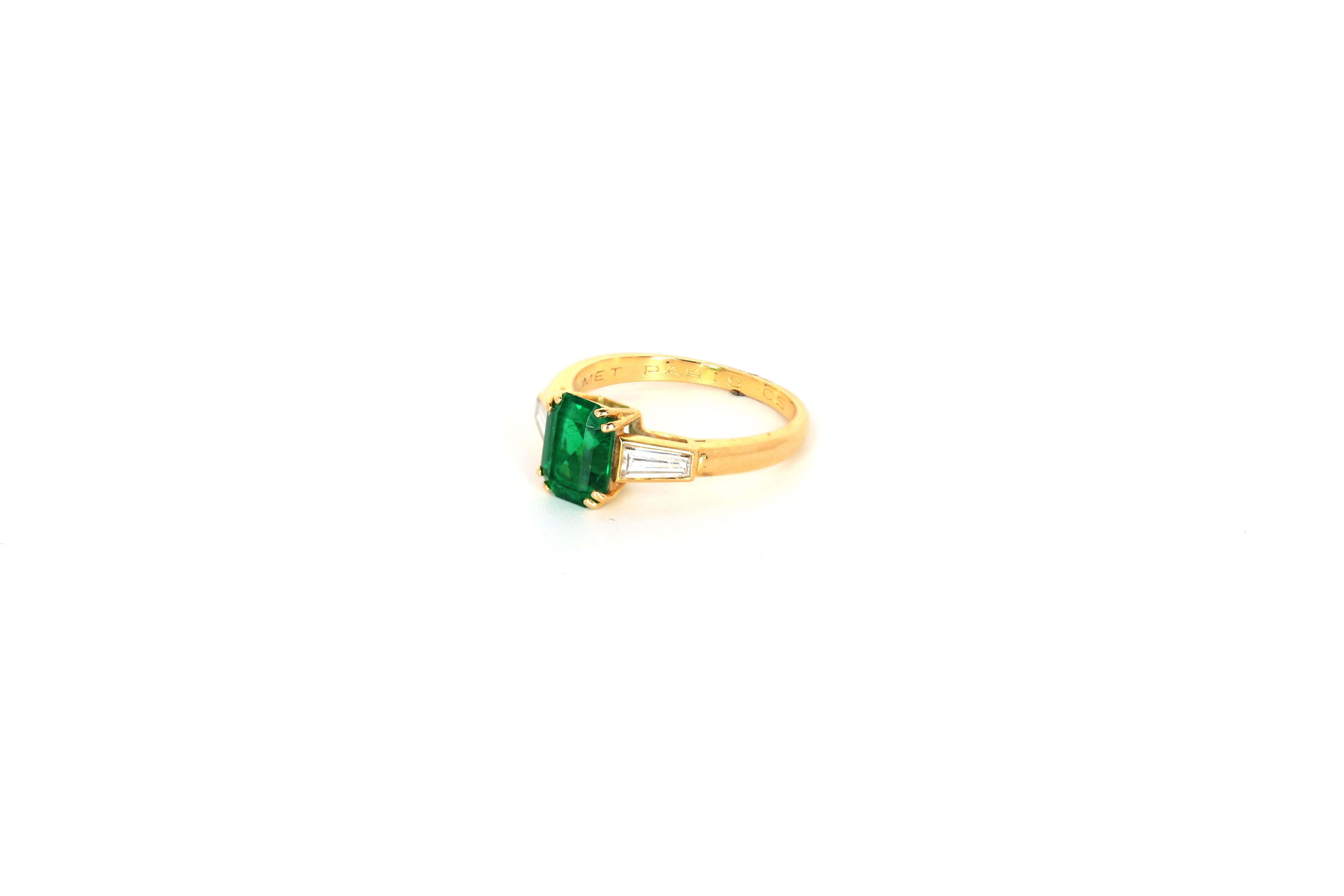 Chaumet 18K yellow gold emerald and diamond ring
Emerald approximately 2 carats, diamonds ~ .25 carats total weight