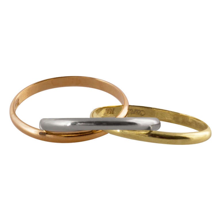 Cartier Trinity ring with interlocking bands in 18K yellow, white and rose gold. Size 9.