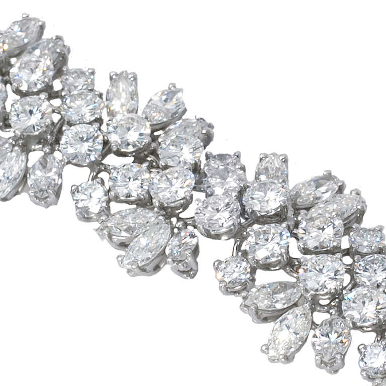 This Harry Winston Diamond bracelet will have you fall in love at first sight. Set with 35.0 ctw. of D-E/IF-VS1 round brilliant and marquise-cut diamonds in Platinum.