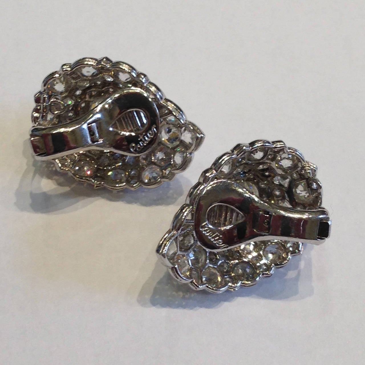 Platinum antique Cartier Fancy Cut Diamond Earrings. GIA Certified 4.79 ct. K/VS2 and 4.90CT.K/VS1 Cushion Cut Center Stone Diamonds. 8.0ctw H-SI Fancy Cut Diamonds Surround the Center Stone in a Pear Shape.