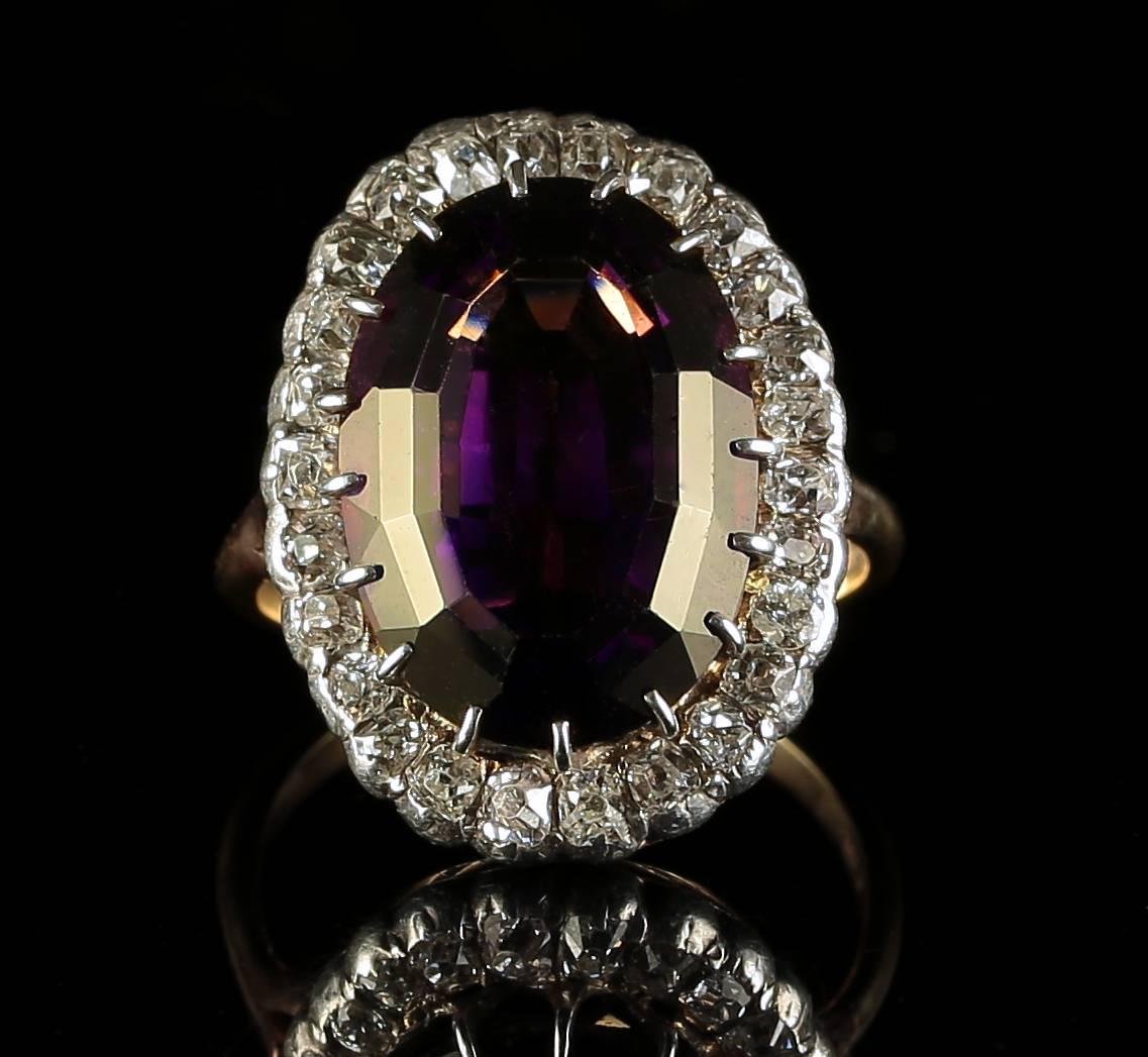 This stunning Antique Victorian yellow gold ring is set with a rich natural Amethyst which is over 16ct in size.Surrounded by 1.25ct of beautiful Old Cut Diamonds.

The Diamonds sparkle continuously and beautifully captivating the allure of natures