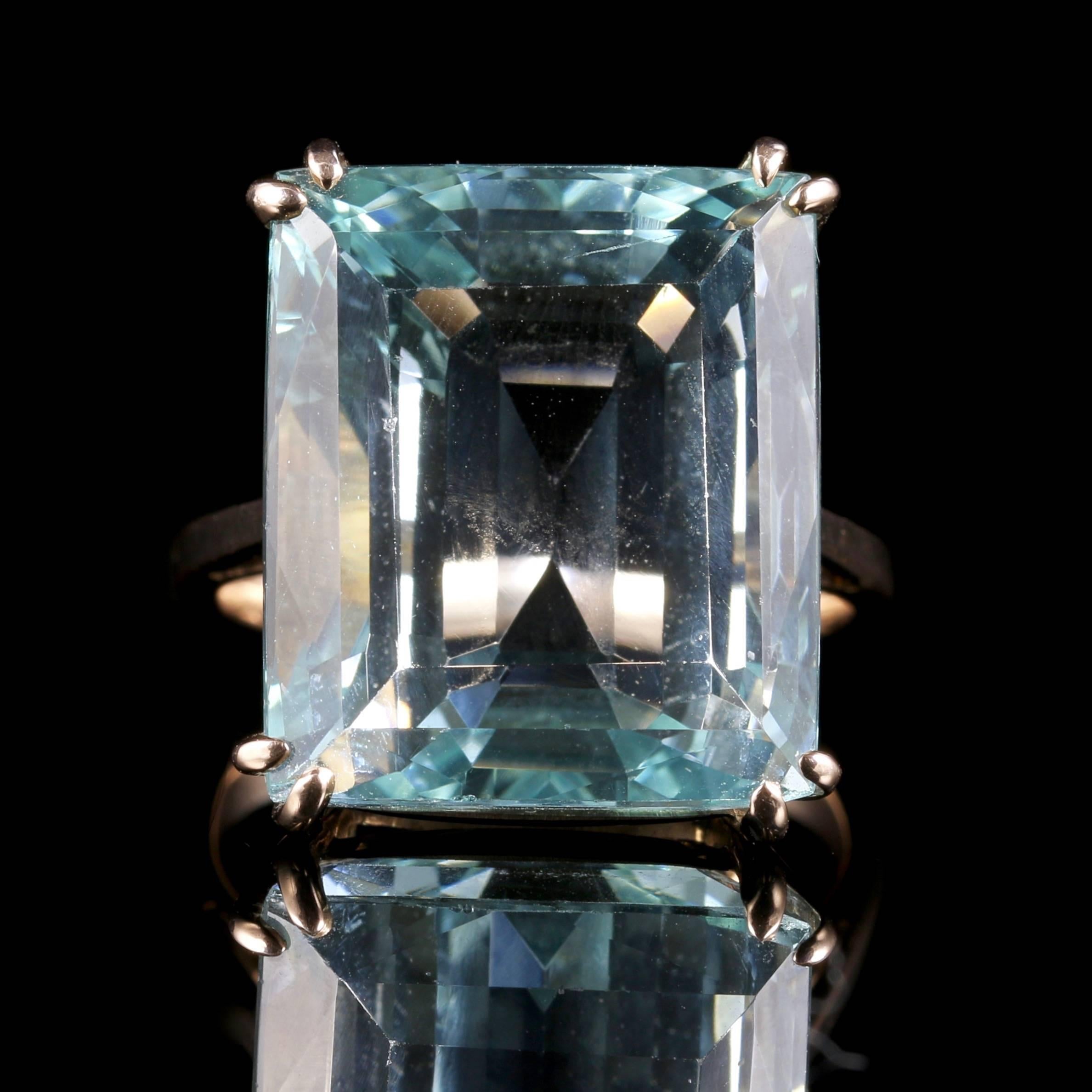 This is a fabulous 15ct yellow gold ring which boasts a 30ct Aquamarine that is Emerald Cut. 

It has the most desirable ocean blue hue which is sought after within the world of Aquamarines. 

The lovely Emerald Cut has beautiful high faceted edges