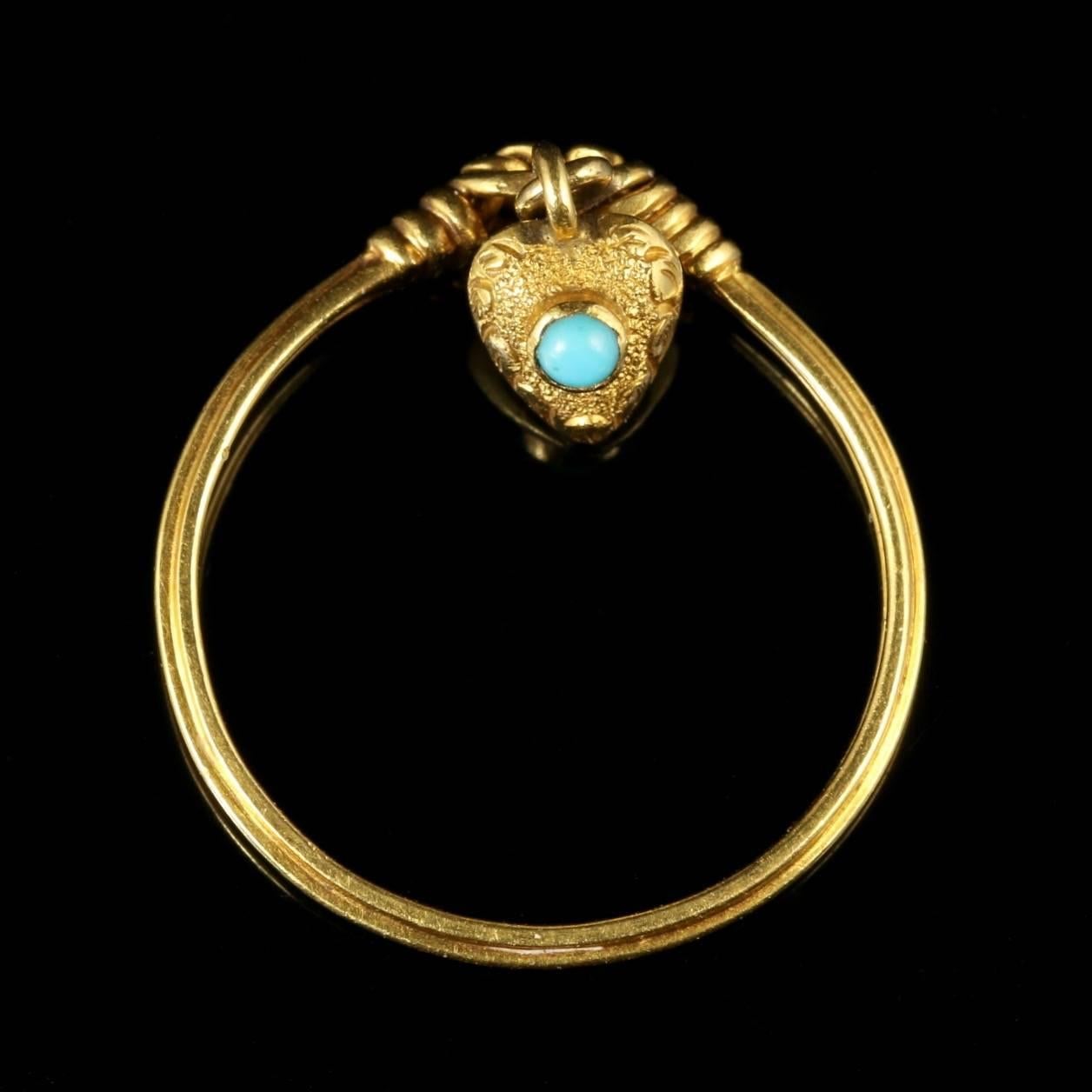 This has to be one of the sweetest Georgian rings we have ever exhibited for sale.

Circa 1780.

A fabulous Georgian 18ct Gold ring which depicts a Gold twisted love knot with a heart dropper cascading off the ring.

On the reverse of this heart