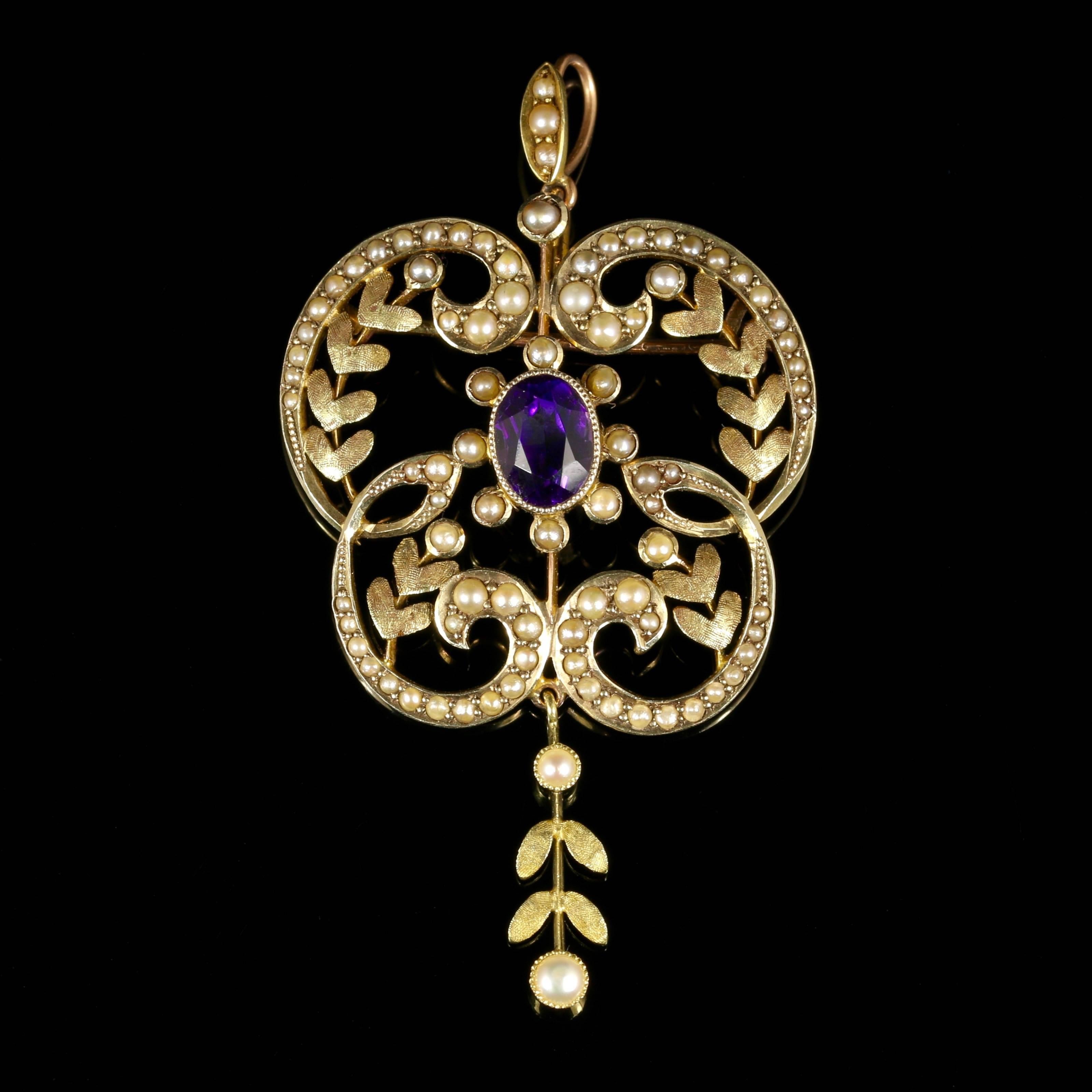 This fabulous 9ct Yellow Gold Victorian large pendant brooch is set with a rich lustrous Amethyst and beautiful Pearls.

This has to be one of the prettiest Victorian Amethyst pendants we have exhibited, with such fine detail. 

The three colours