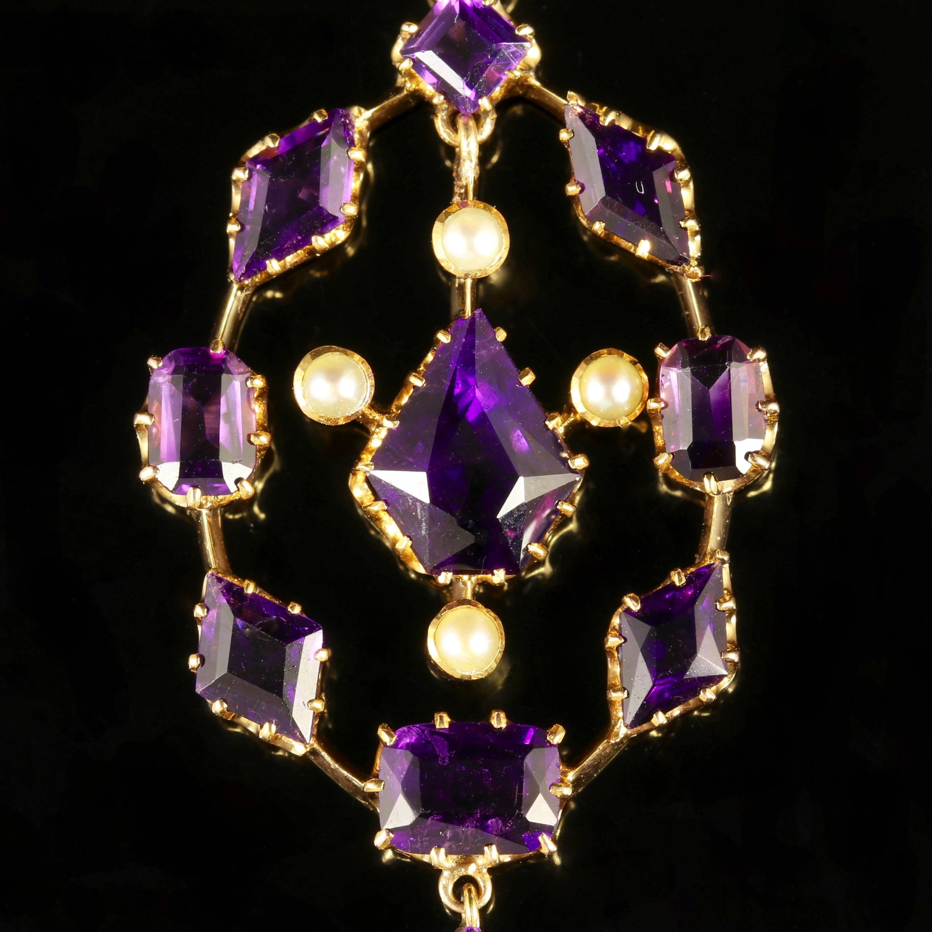 This fabulous antique Victorian 15ct Yellow Gold necklace is adorned with Amethysts and Pearls. 

All genuine Victorian, Circa 1880.

Stunning deep purple hand cut Amethysts are set into a 15ct Gold gallery with a central swinging pendulum.