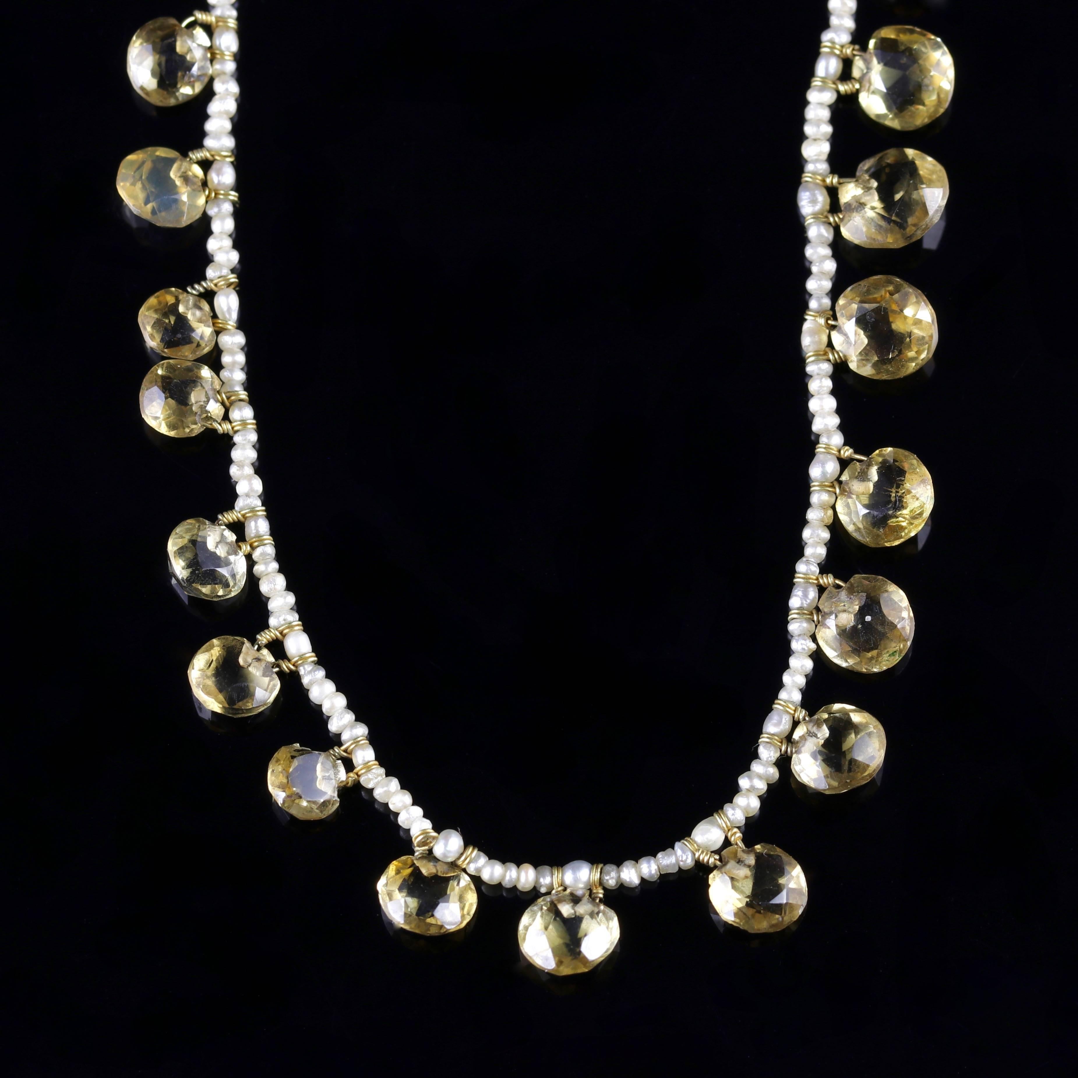 This very beautiful Citrine and natural Pearl necklace is Circa 1870.

Twenty five hand cut Citrines cascade around the garland Pearl necklace.

The Citrine’s sparkle and have a crisp, radiant quality about them. 

The name Citrine is derived from