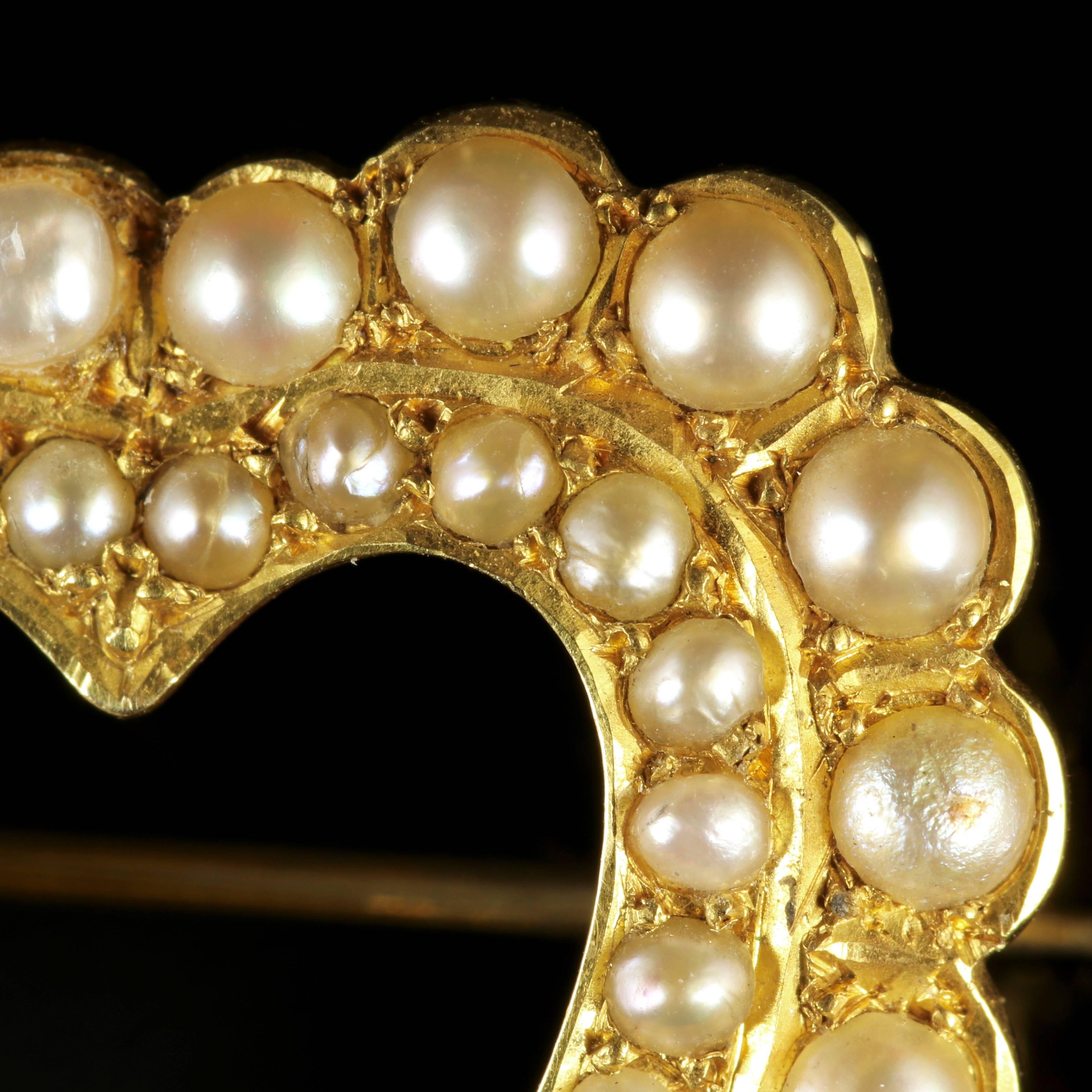 This beautiful, genuine, Victorian 15ct Yellow Gold heart brooch is adorned with fresh water Pearls.

A genuine Victorian piece, Circa 1900.

A halo of larger Pearls on the outer gallery and smaller Pearls on the inner gallery compliment the heart