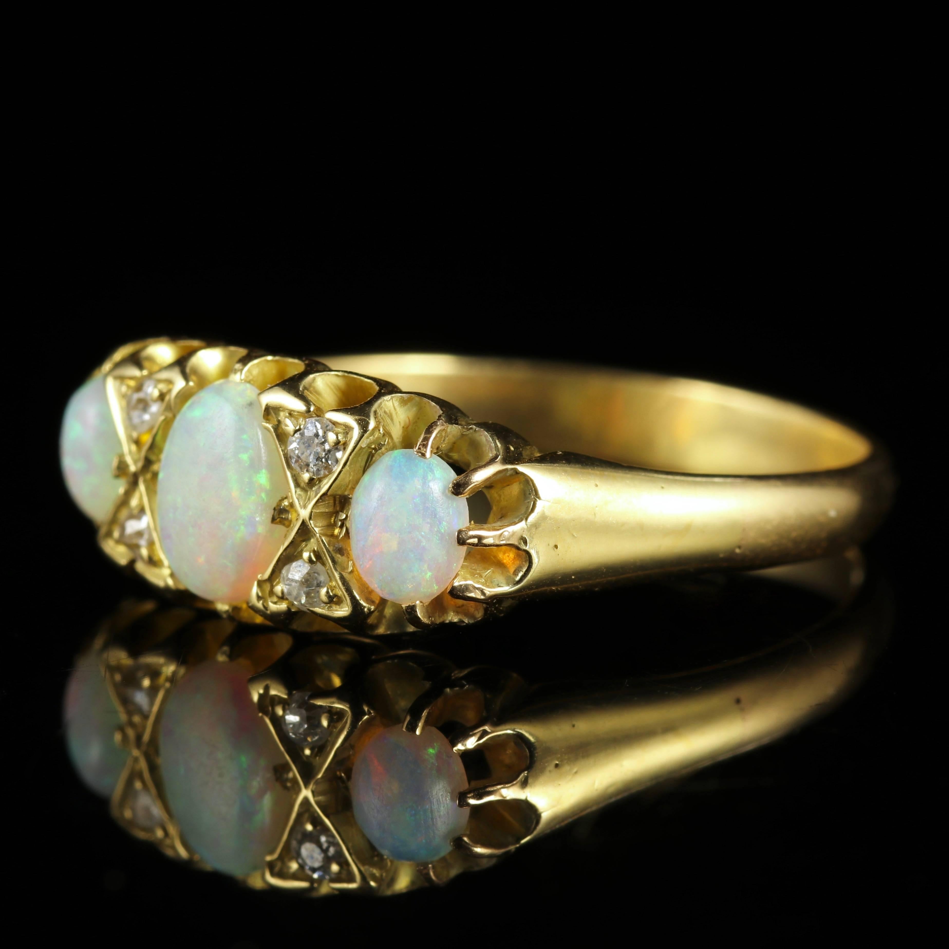 This fabulous Antique 18ct Yellow Gold Victorian natural Opal and Diamond ring is Circa 1900.

A trilogy of natural Opals adorn the ring, with smaller Diamonds set into the gallery.

Trilogy means past, present, future Or those 3 little words -I