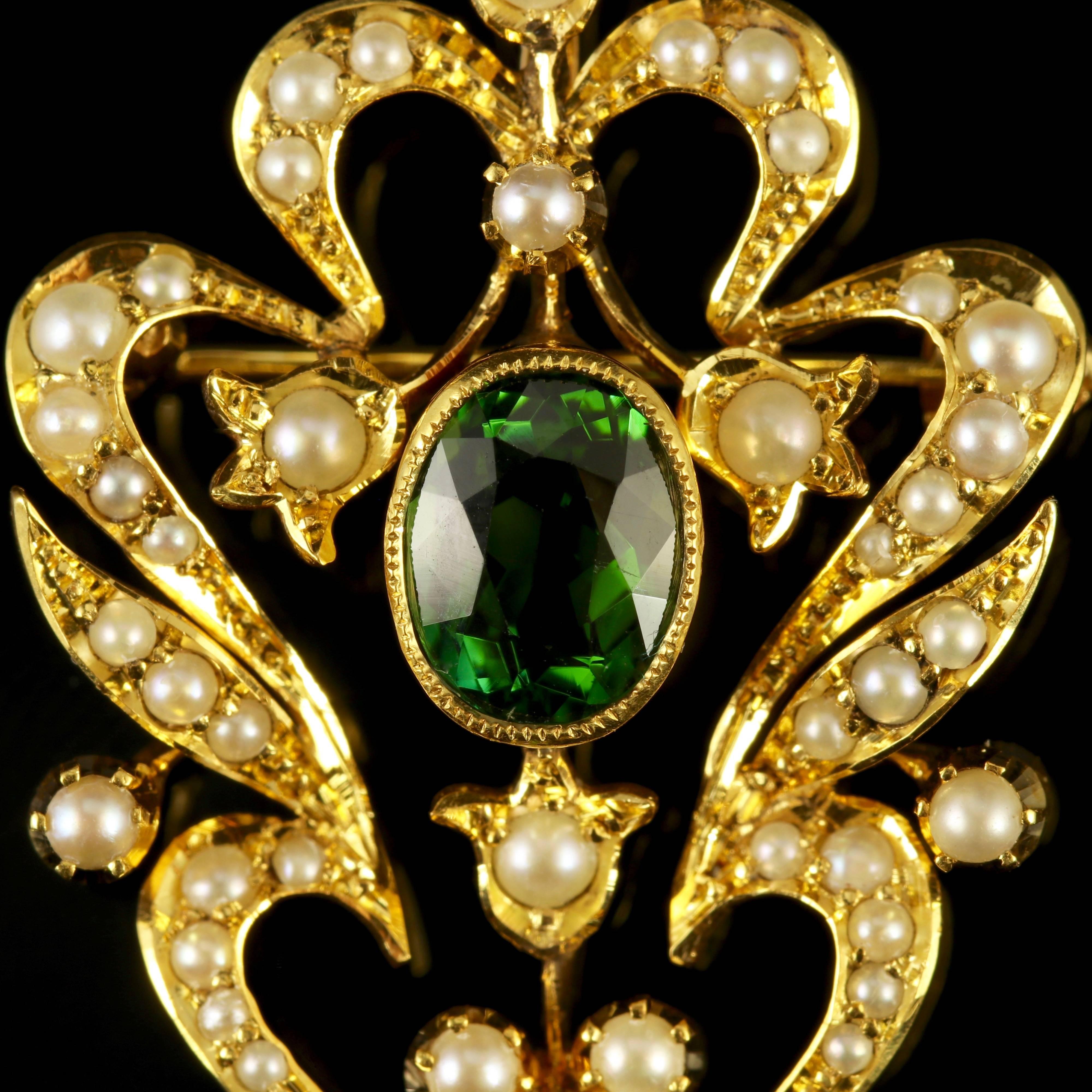 This fabulous 15ct Yellow Gold antique Victorian pendant brooch is adorned with Pearls and green Tourmaline’s, Circa 1900.

The central green Tourmaline is 1.50ct in size, the dropper stone is 1.30ct in size.

Green Tourmaline’s are believed to