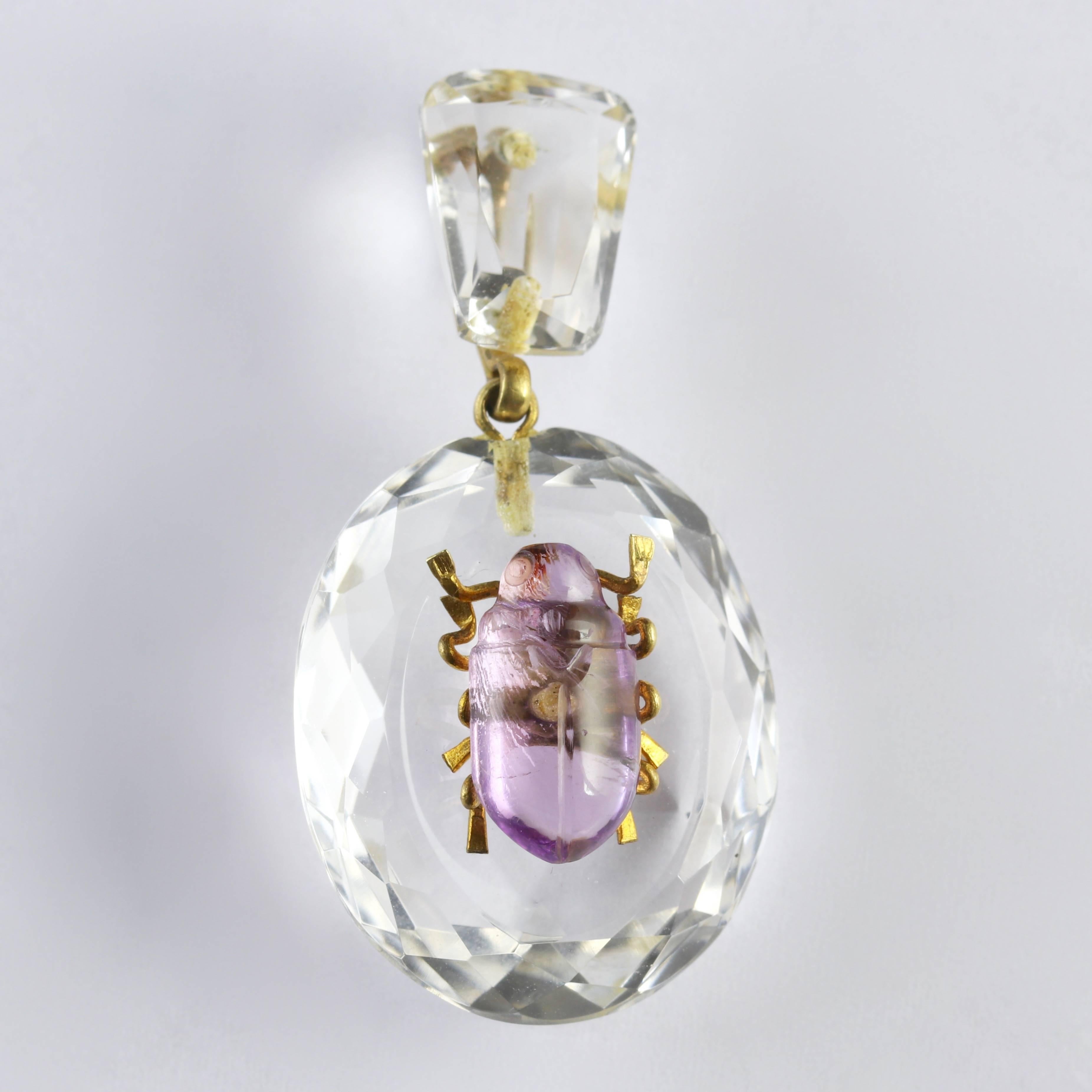 This genuine Antique Victorian Rock Crystal pendant is Circa 1880.

Set with a Cabochon Amethyst bug in the centre with Gold legs and loop.

Amethyst has been highly esteemed throughout the ages for its stunning beauty and legendary powers to