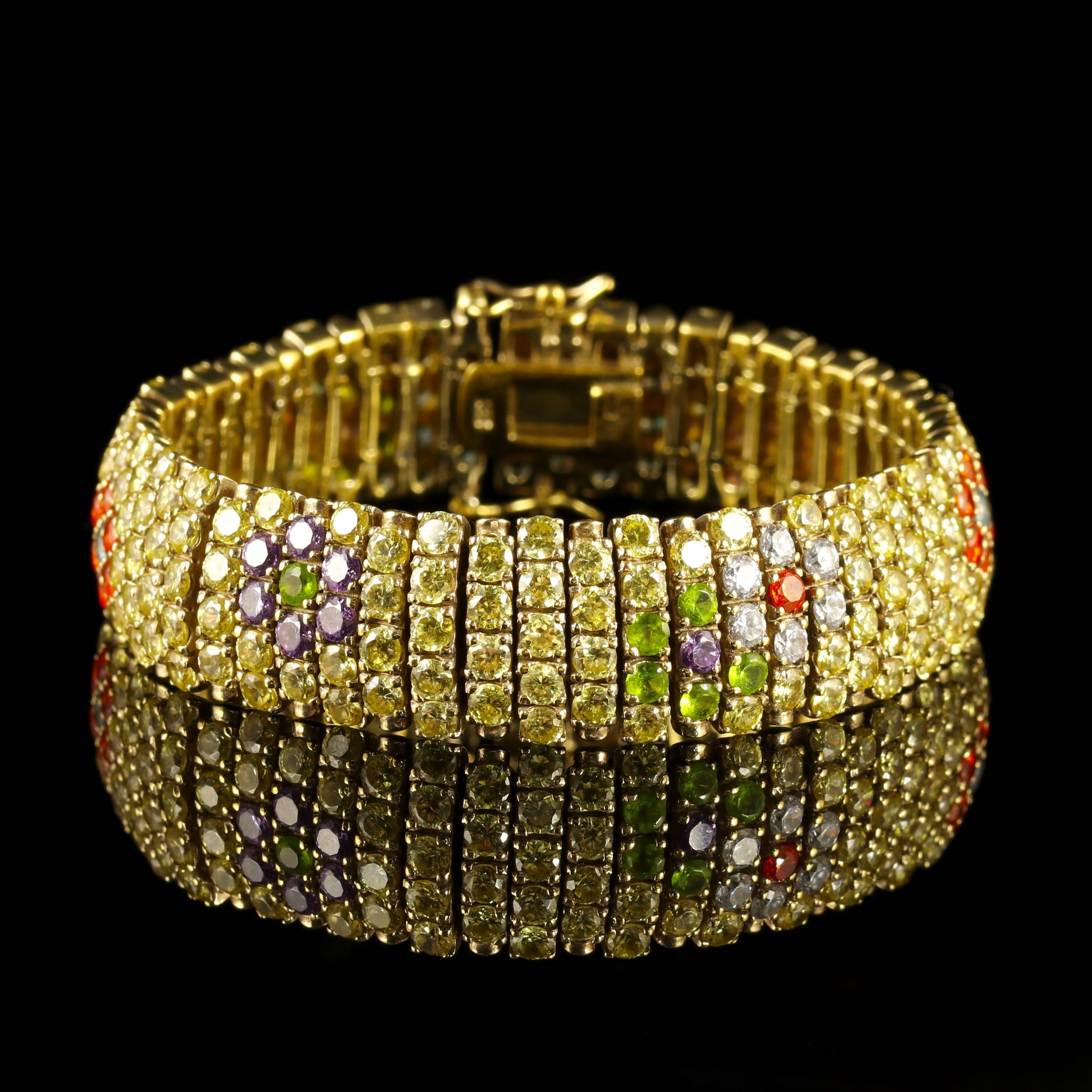 This is one of the most fabulous French Paste bracelets we have had the privilege of purchasing.

A genuine French piece, Circa 1930.

The Bracelet is adorned with lovely colourful Paste Stones in a detailed pave setting of floral motifs in rich