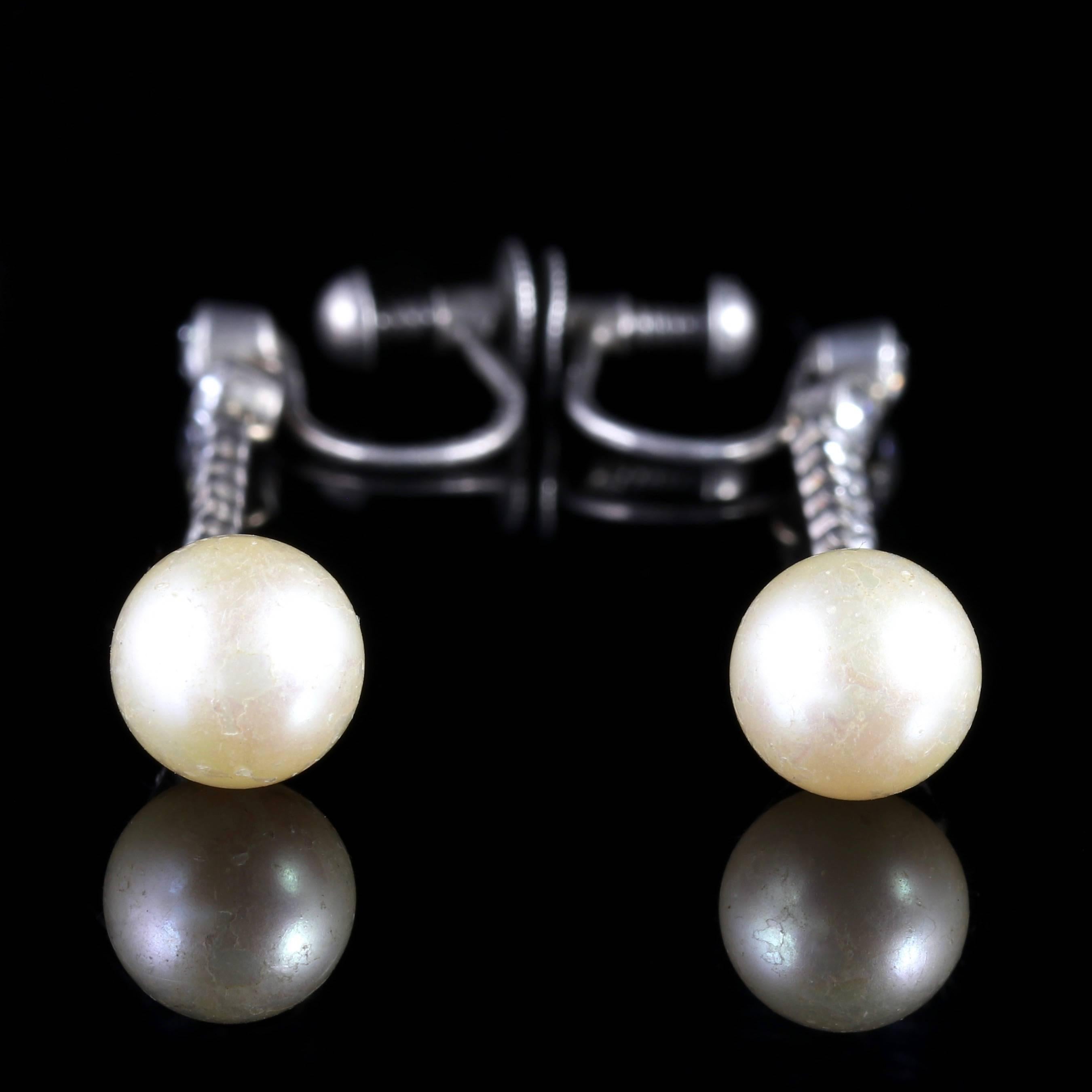 To read more please click continue reading below-

These fabulous long Sterling Silver Edwardian Pearl earrings are stunning. 

Genuine Edwardian, Circa 1915. 

Set in Sterling Silver with Paste Stones cascading down the gallery to a large Faux