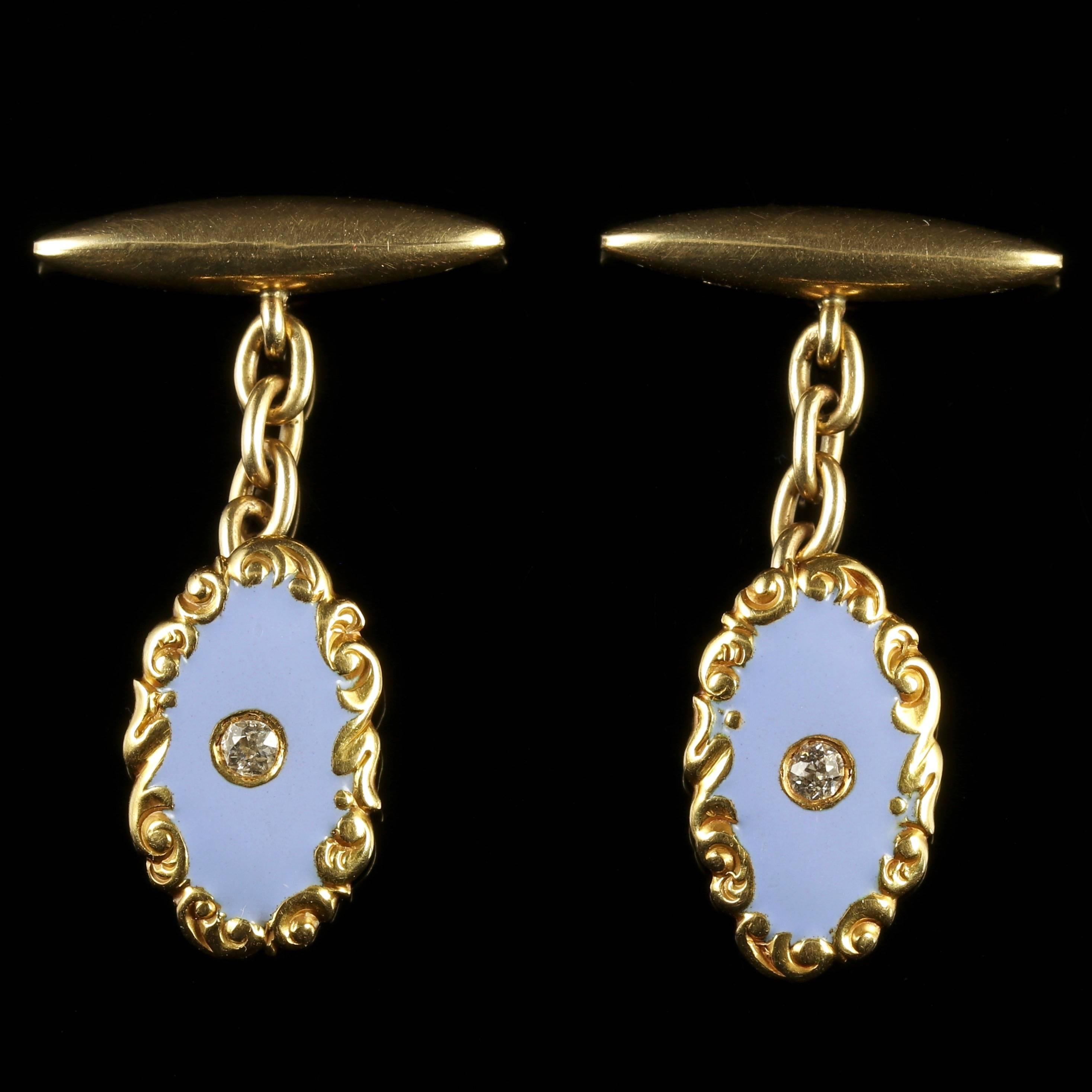 These spectacular 9ct Yellow Gold cufflinks are set with fabulous victorian detail.

The cufflinks have a lovely duck egg blue Enamel front adorned with a Diamond on the face of each. 

The Diamonds are a beautiful cushion cut set in 9ct