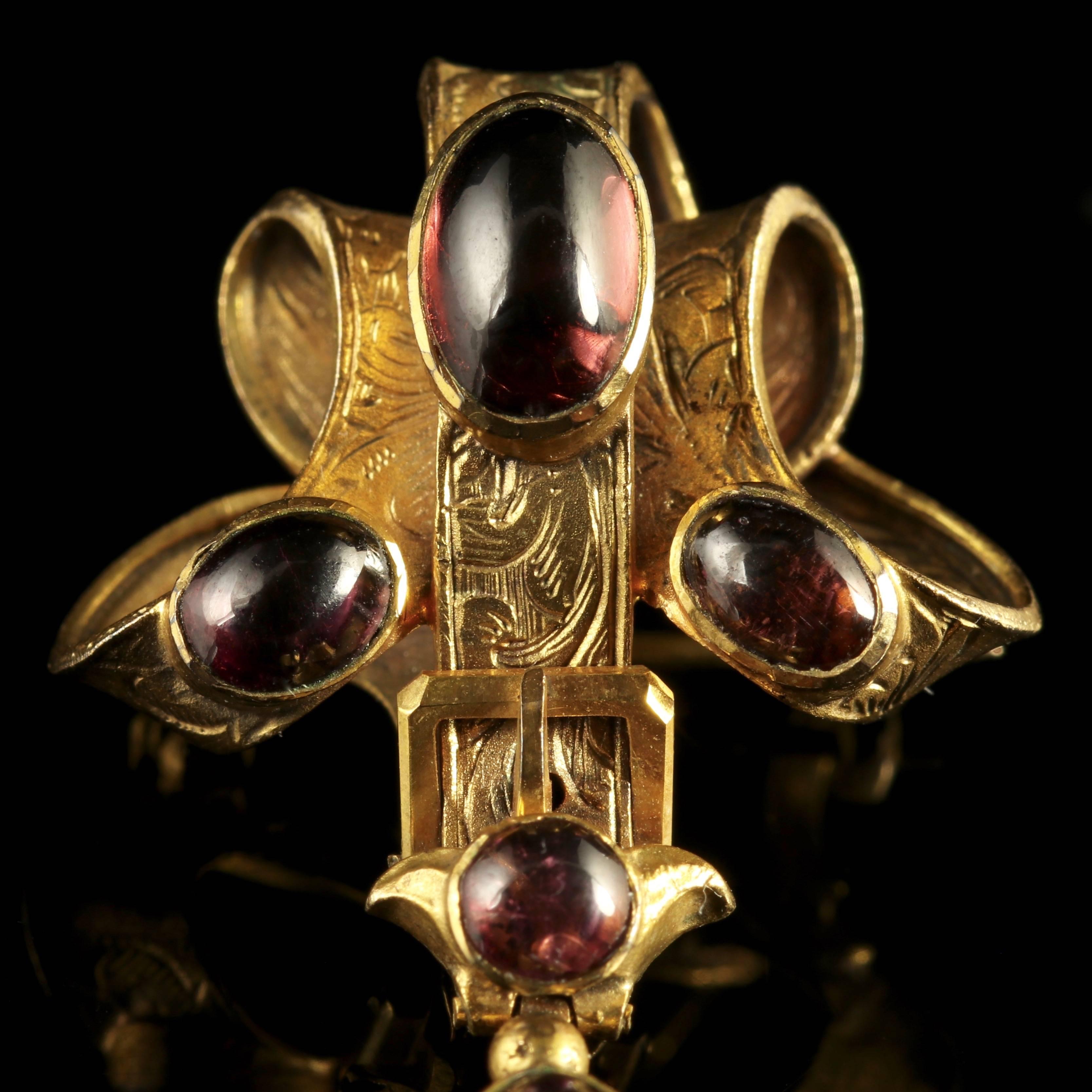 To read more please click continue reading below-

This fabulous 9ct Yellow Gold brooch is set with five beautiful deep red Cabochon Garnets.

Genuine Victorian, Circa 1900. 

The beautiful Garnets are collet set, to maximise their glory. 

The