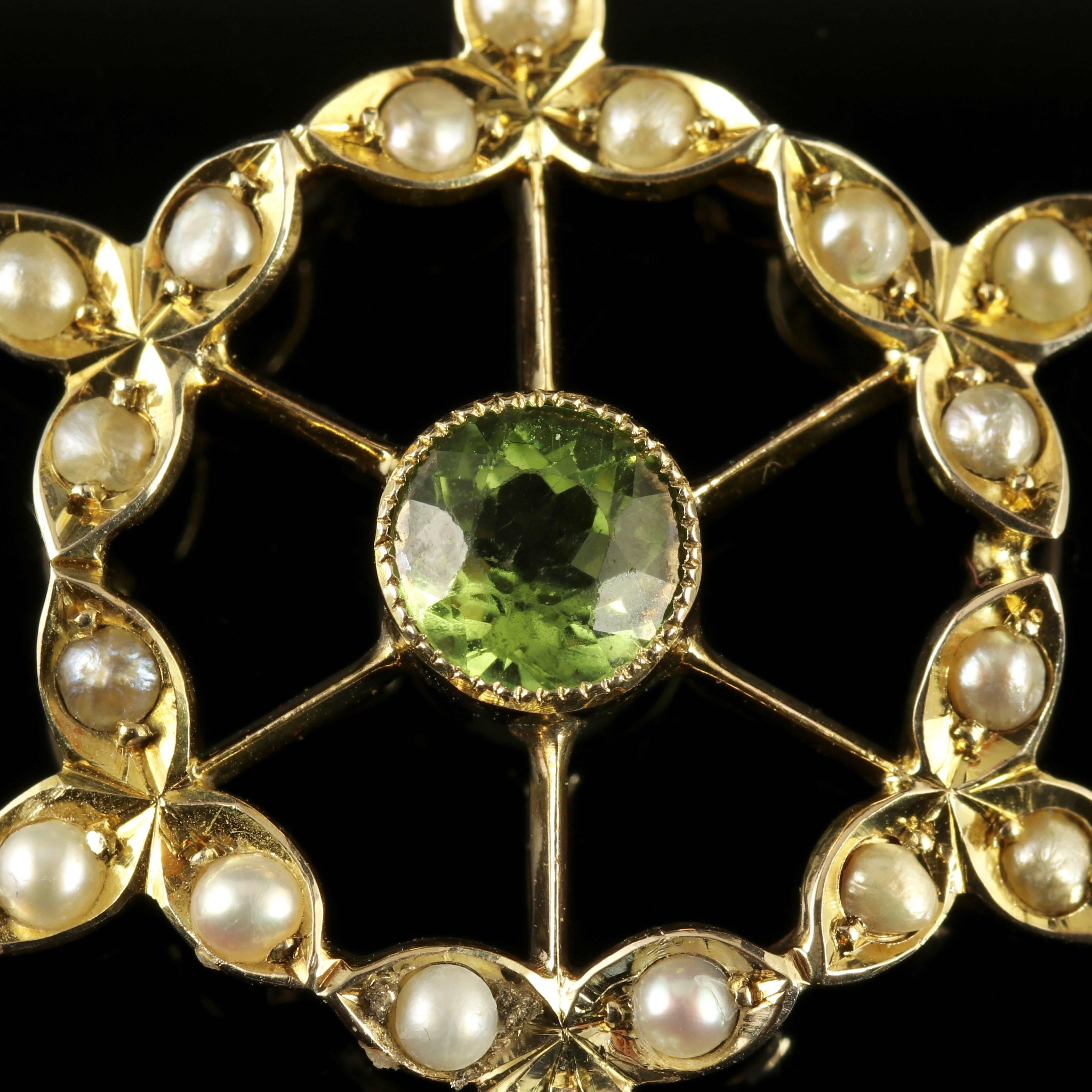 To read more please click continue reading below-

This fabulous 9ct Yellow Gold Suffragette pendant is genuine Victorian, Circa 1900. 

The beautiful floral pendant is adorned with Pearls an Amethyst dropper and a central green Peridot displaying