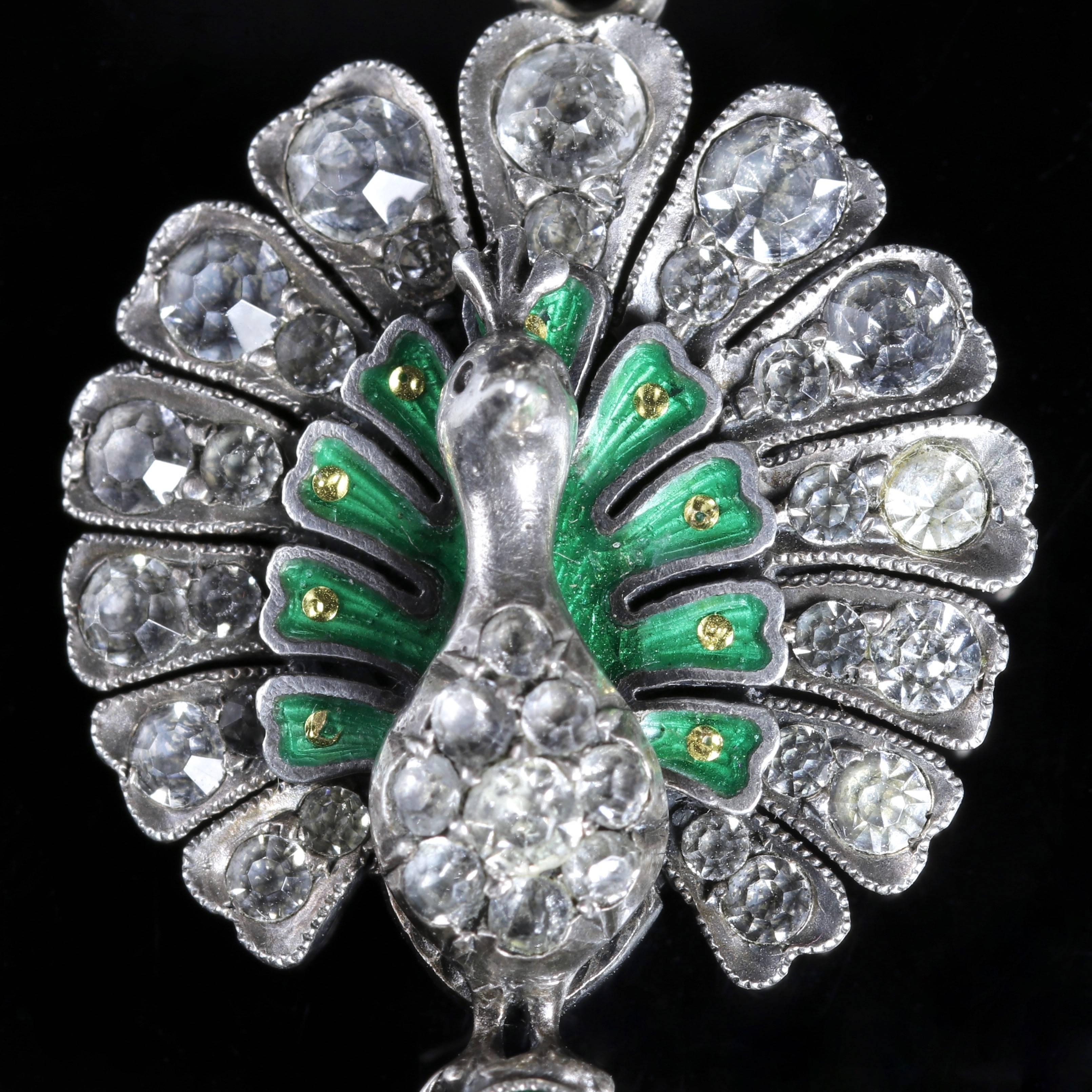 To read more please click continue reading below-

This fabulous Sterling Silver Victorian pendant depicts a peacock, all authentic Circa 1900 representing the Suffragette period.

Suffragettes liked to be depicted as feminine, their jewellery was