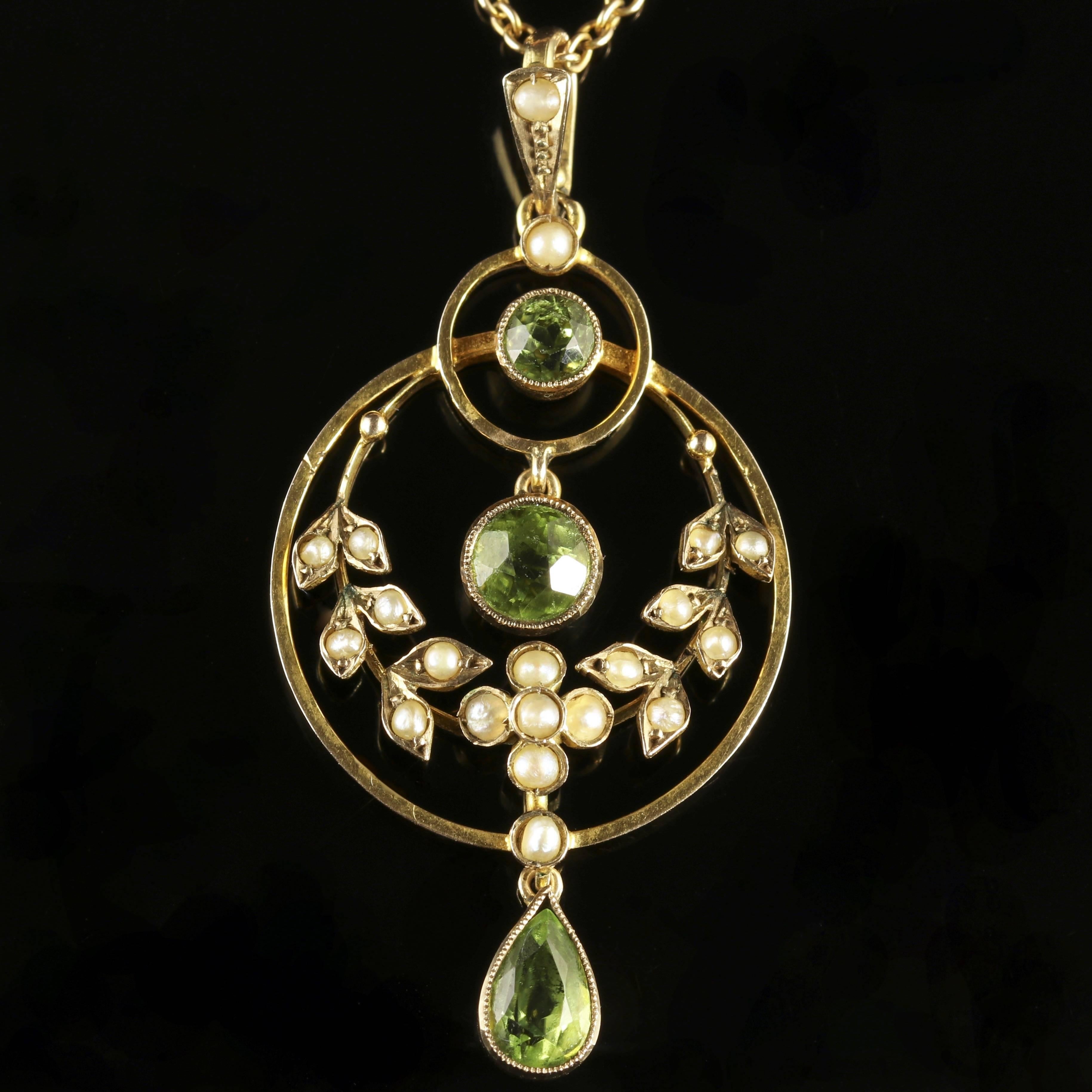 To read more please click continue reading below-

This fabulous 9ct Yellow Gold necklace is genuine Victorian, Circa 1900

The beautiful floral pendant is adorned a trilogy of rich green Peridots cascading down the central gallery.

The Peridot is