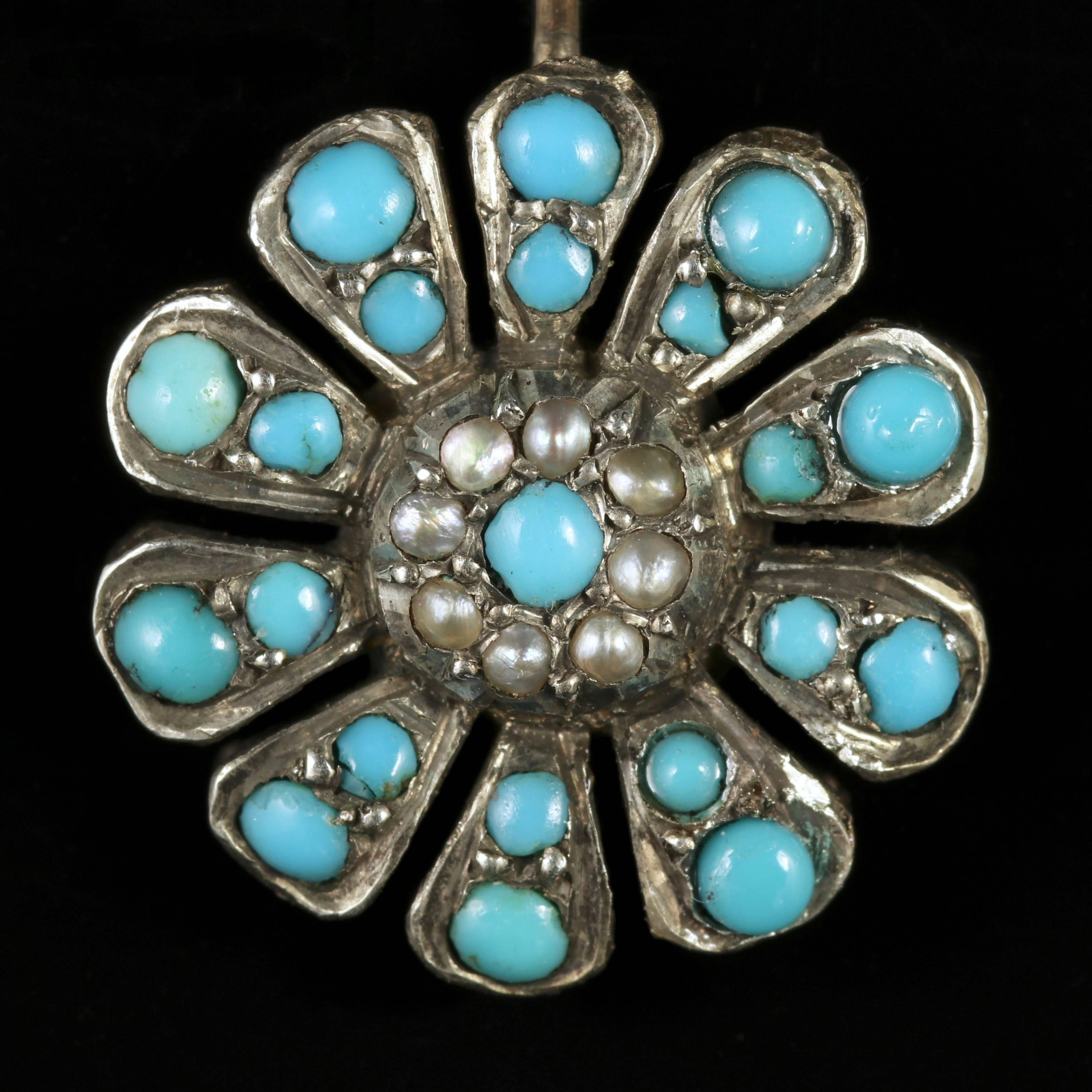 To read more please click continue reading below-
 
These fabulous 18ct Yellow Gold and Silver flower earrings are genuine Victorian, Circa 1900. 

The beautiful earrings are adorned with rich blue natural Turquoises and a halo of Pearls which chase