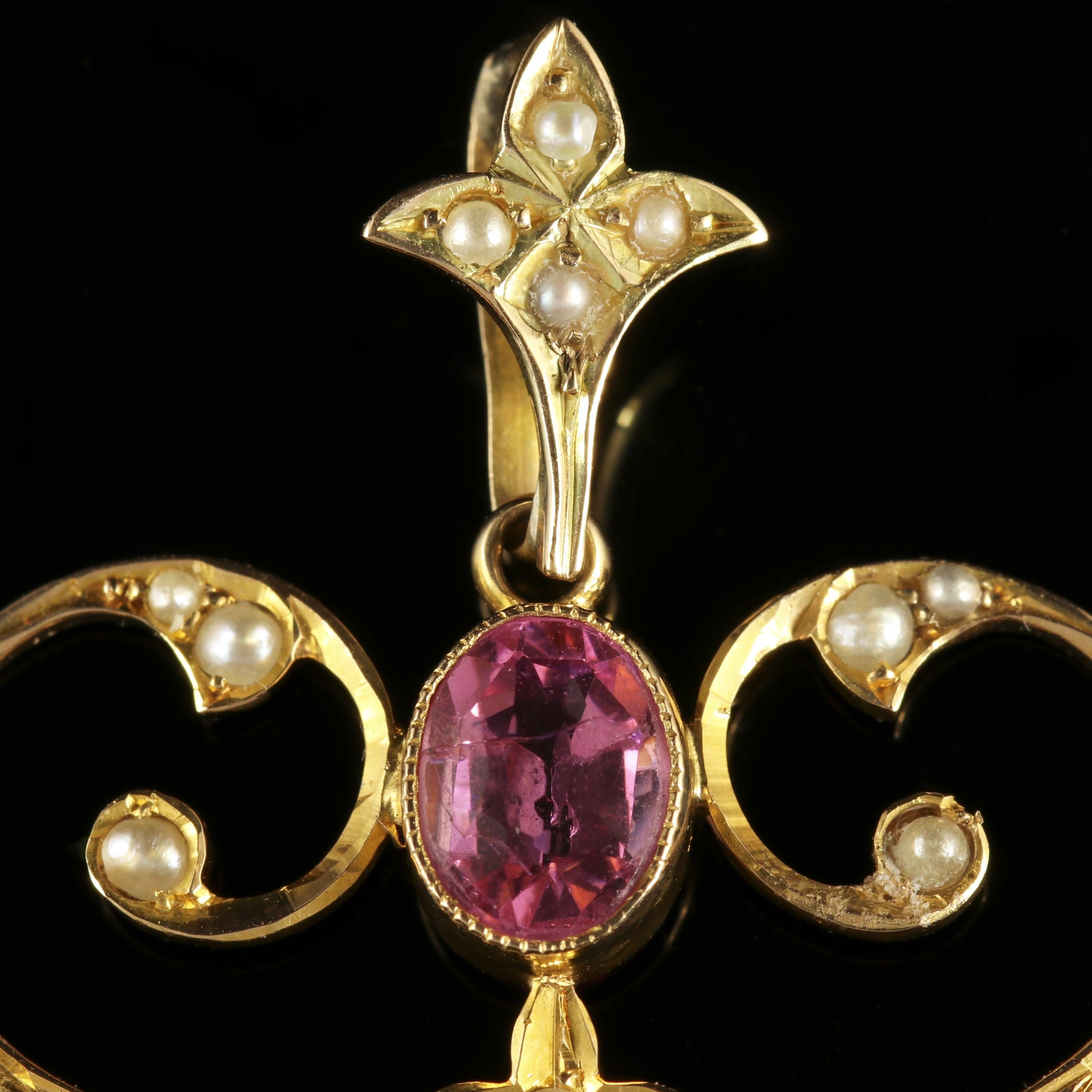 To read more please click continue reading below-

This stunning 15ct Yellow Gold pendant is genuine Victorian, Circa 1880.

Set with four beautiful rich pink Tourmalines and decorated with Pearls which compliment each other perfectly.

Pink