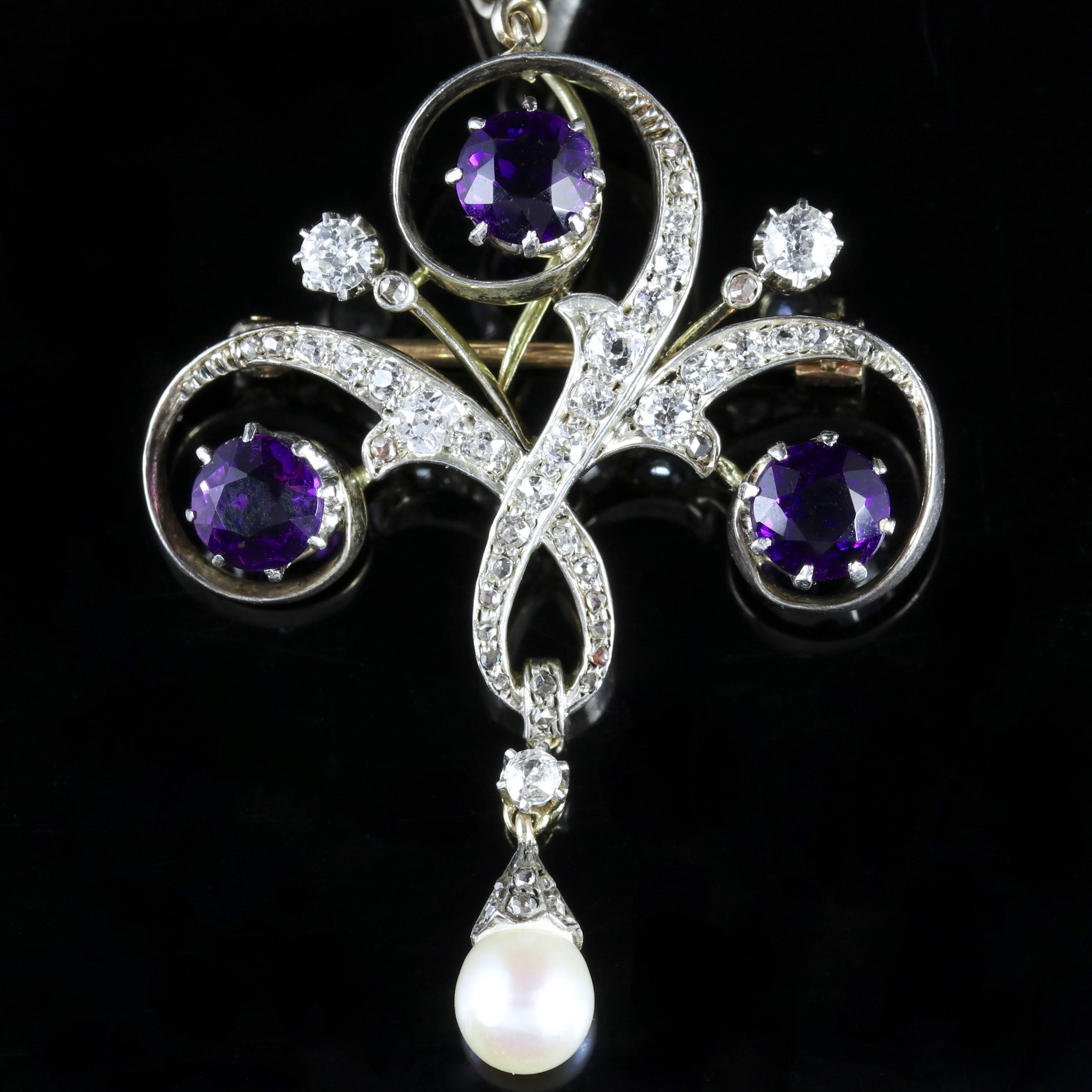 To read more please click continue reading below-

This is a fabulous all Platinum necklace leading to a stunning 18ct Yellow Gold Diamond and Amethyst pendant brooch.

A trilogy of 0.75ct Amethysts are set into this fabulous pendant and adorned